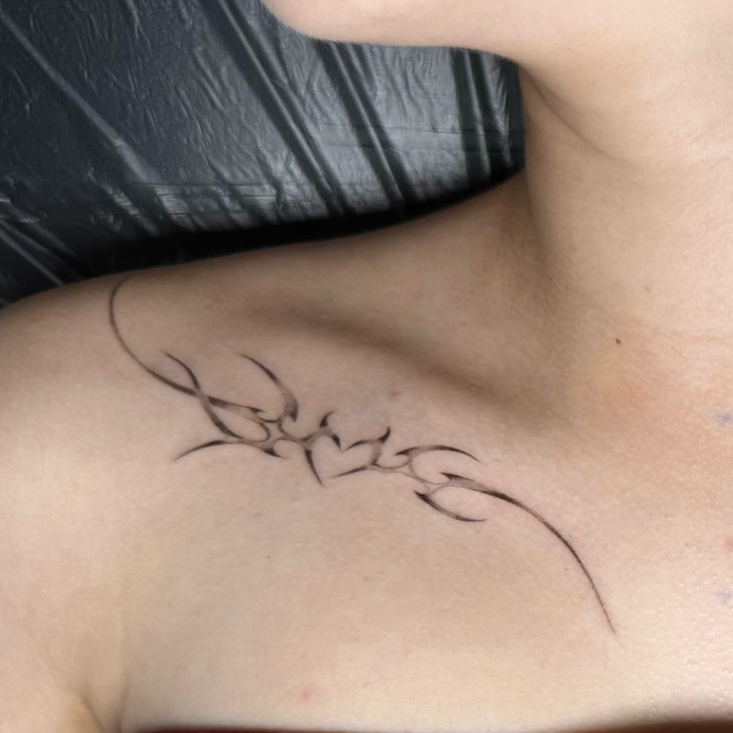 Spider tribal tattoo on the chest by Casper Tattoos Toronto