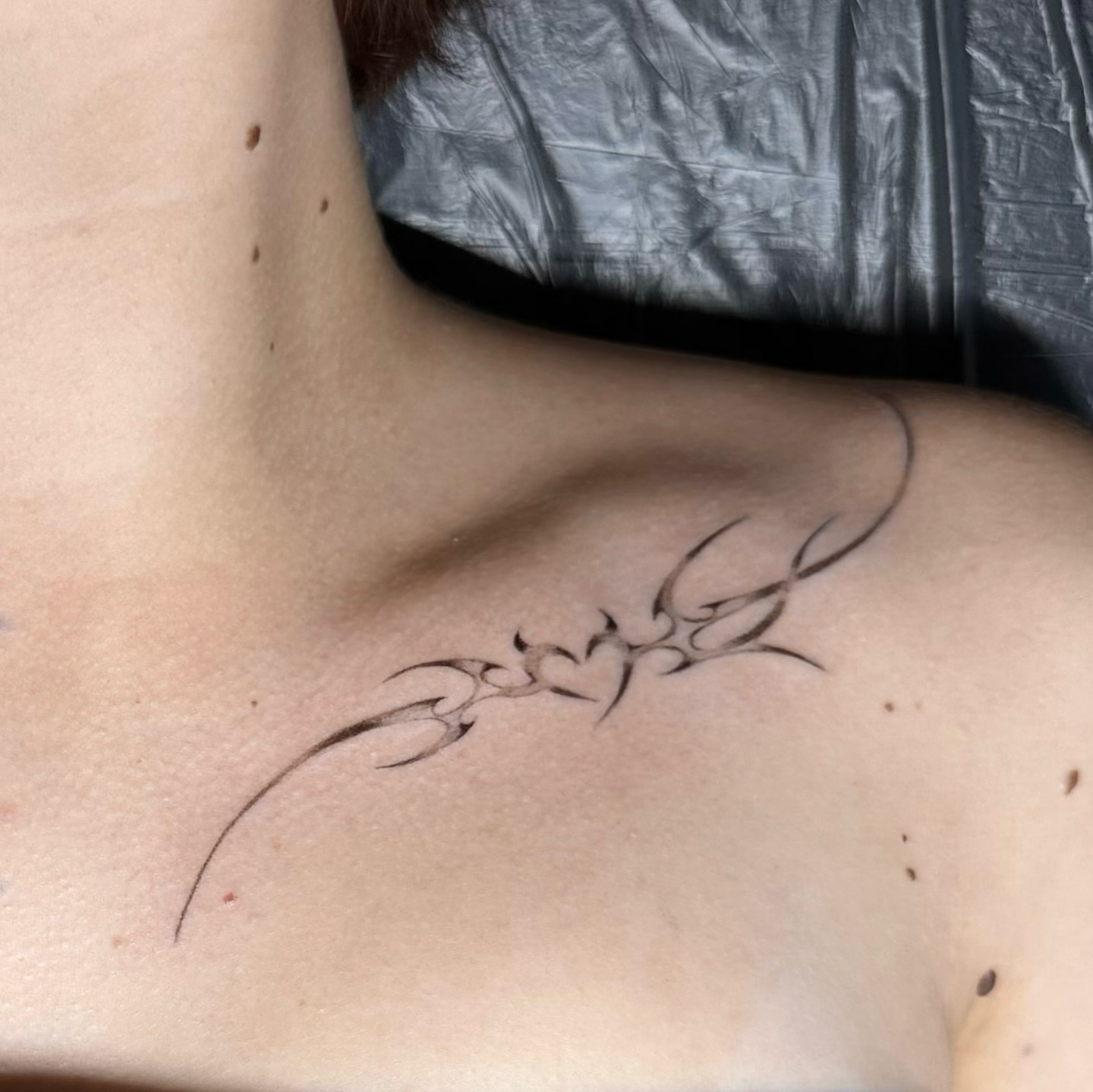 Tribal design tribal tattoo on the neck by Casper Tattoos Toronto