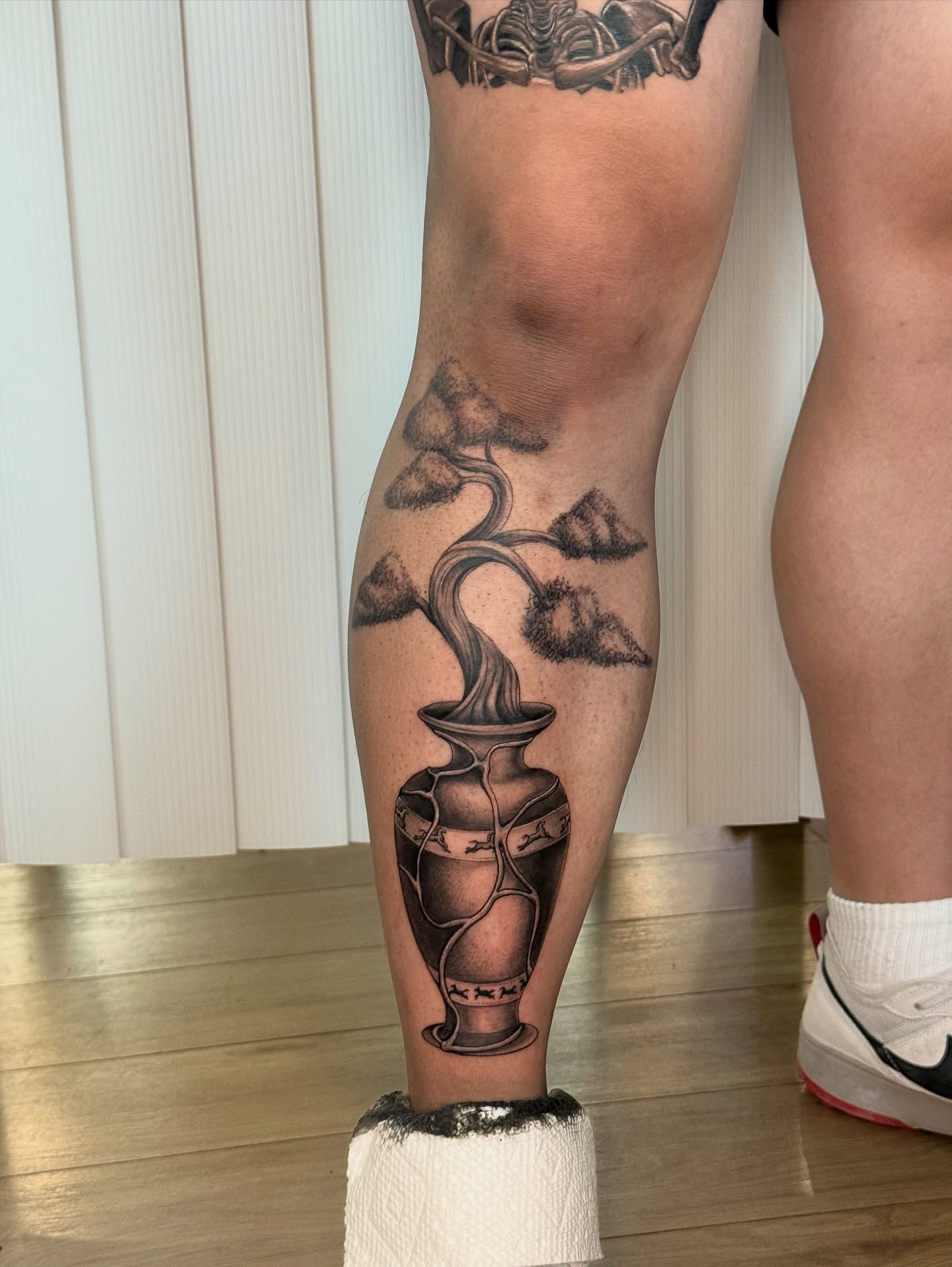 Vase with smoke black and grey tattoo on the calf by Khang🇻🇳