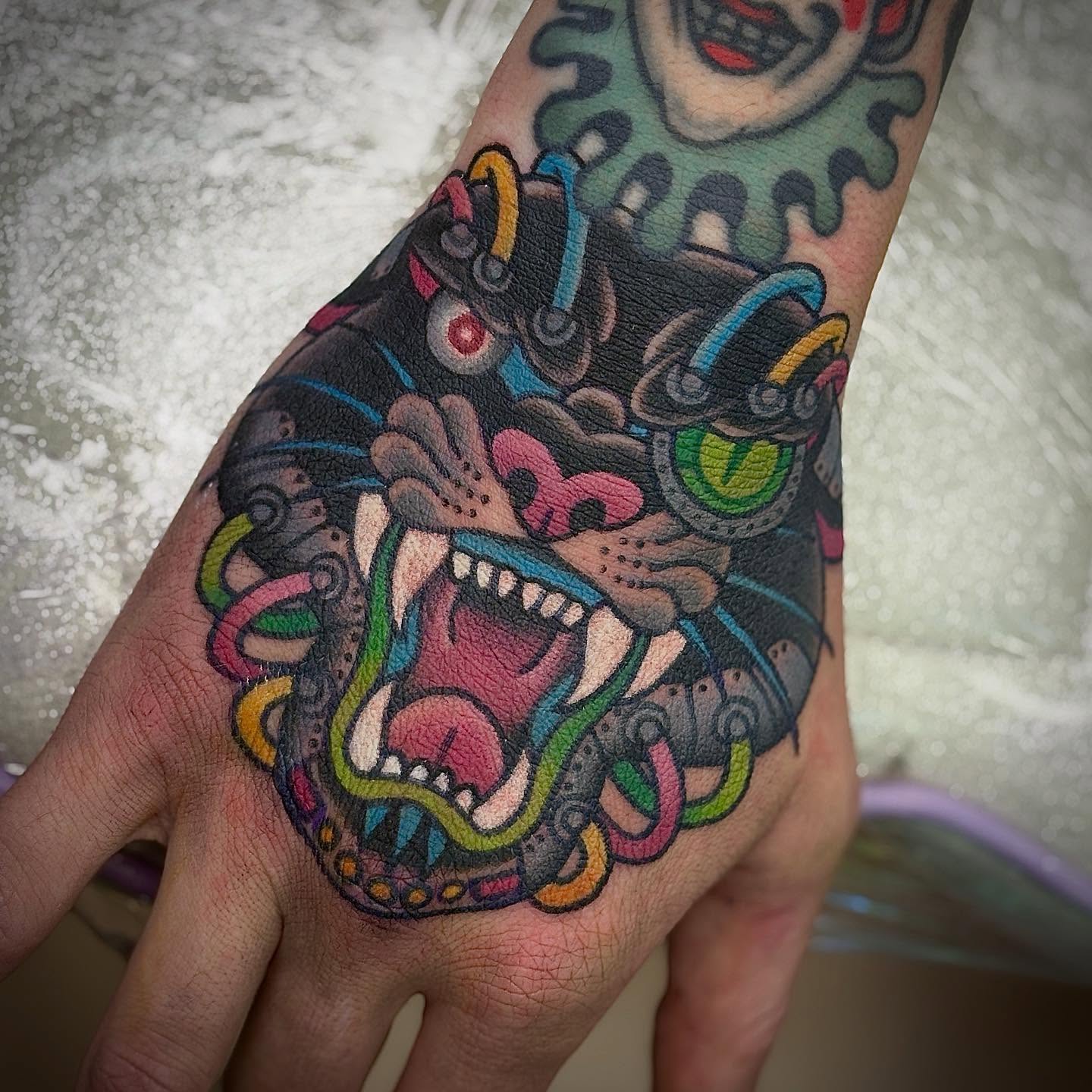 Angry mask Chicano tattoo on the hand by ♥ Brynn Allyn ♥