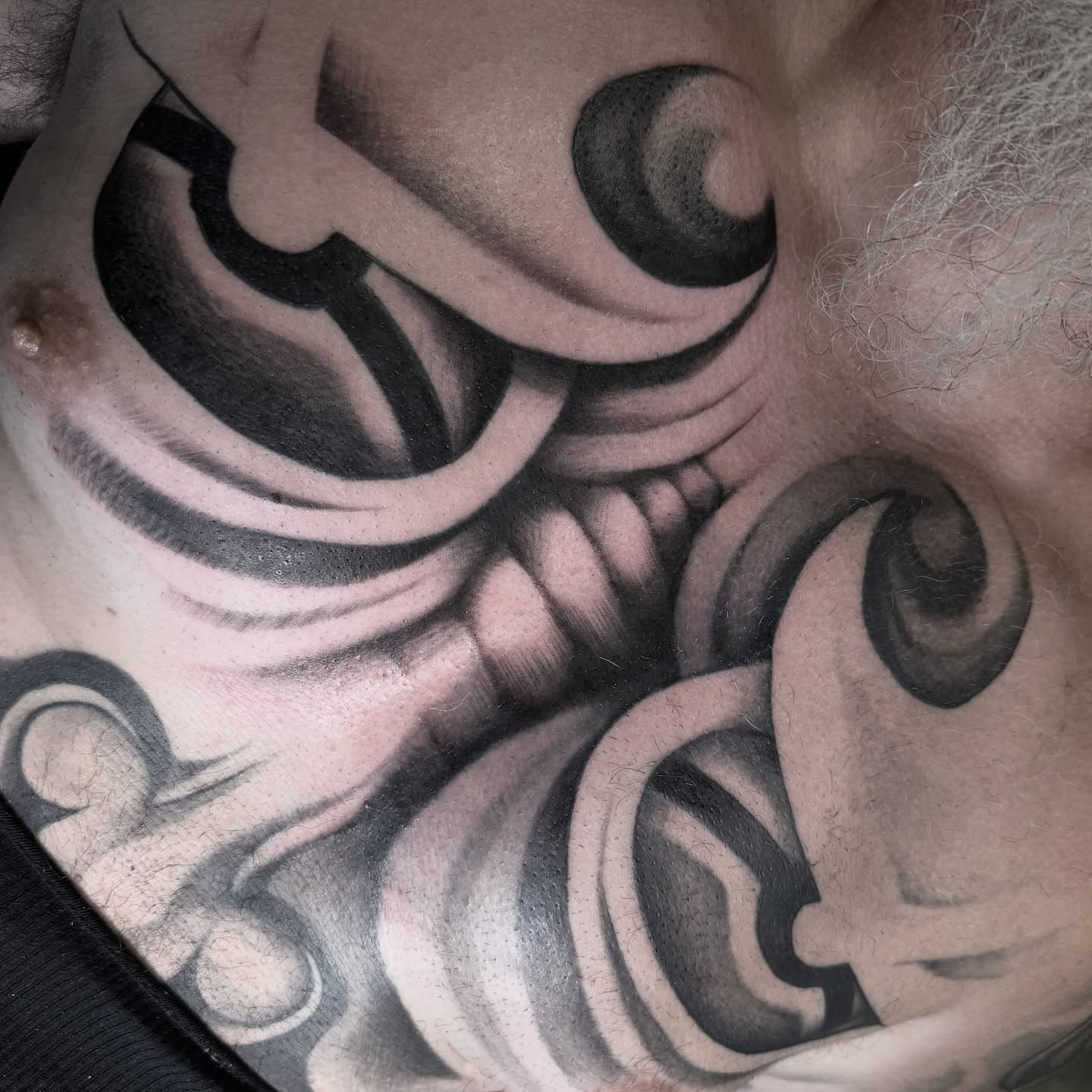 Swirls black and grey tattoo on the chest by ⛓️ 𝓑𝓻𝓸𝓸𝓴𝓮𝓵𝓵𝓮 𝓑𝓸𝓶𝓫𝓼𝓱𝓮𝓵𝓵𝓮 ⛓️