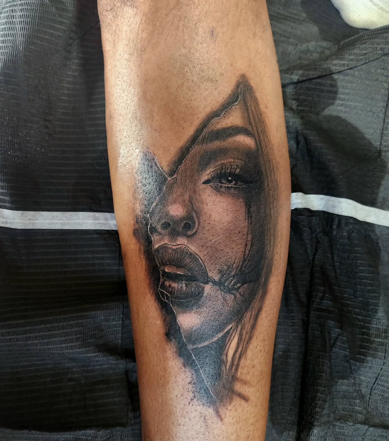Woman's face realism tattoo on the forearm by Sonia