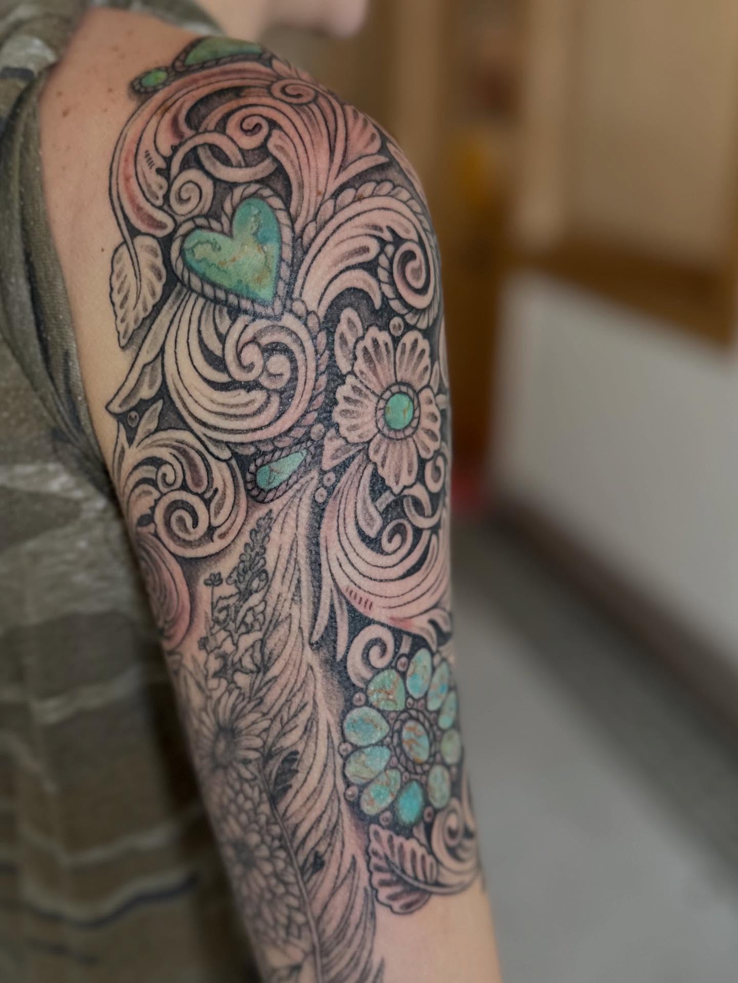 Floral and heart design neo-traditional tattoo on the forearm by Abigail Townsend