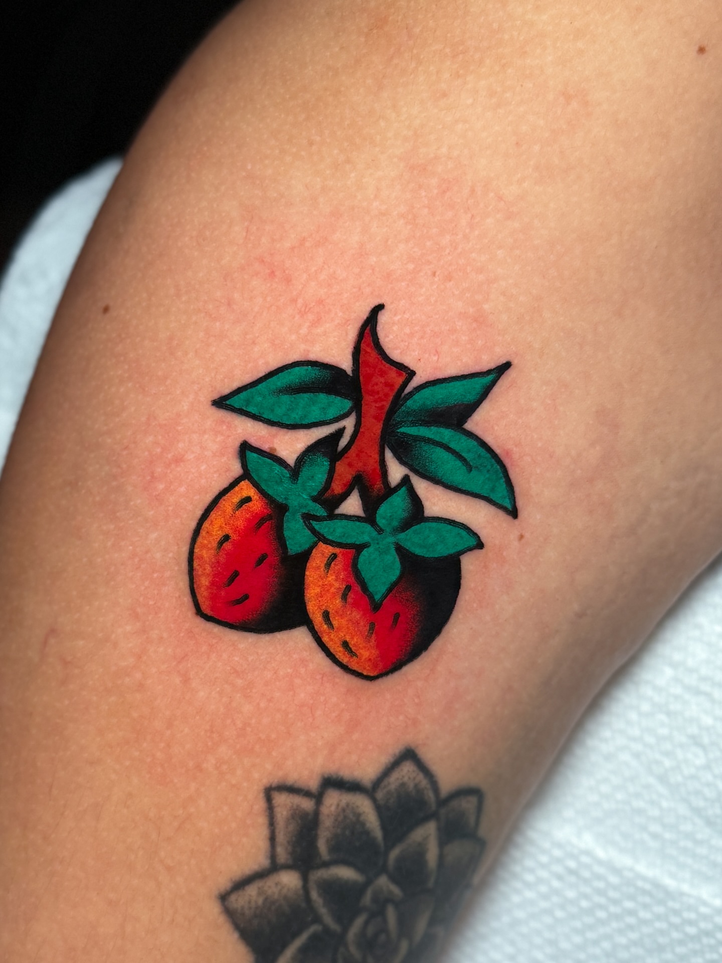 Strawberries American traditional tattoo on the forearm by οΌππ¨ππ¨οΌ, New York, New York