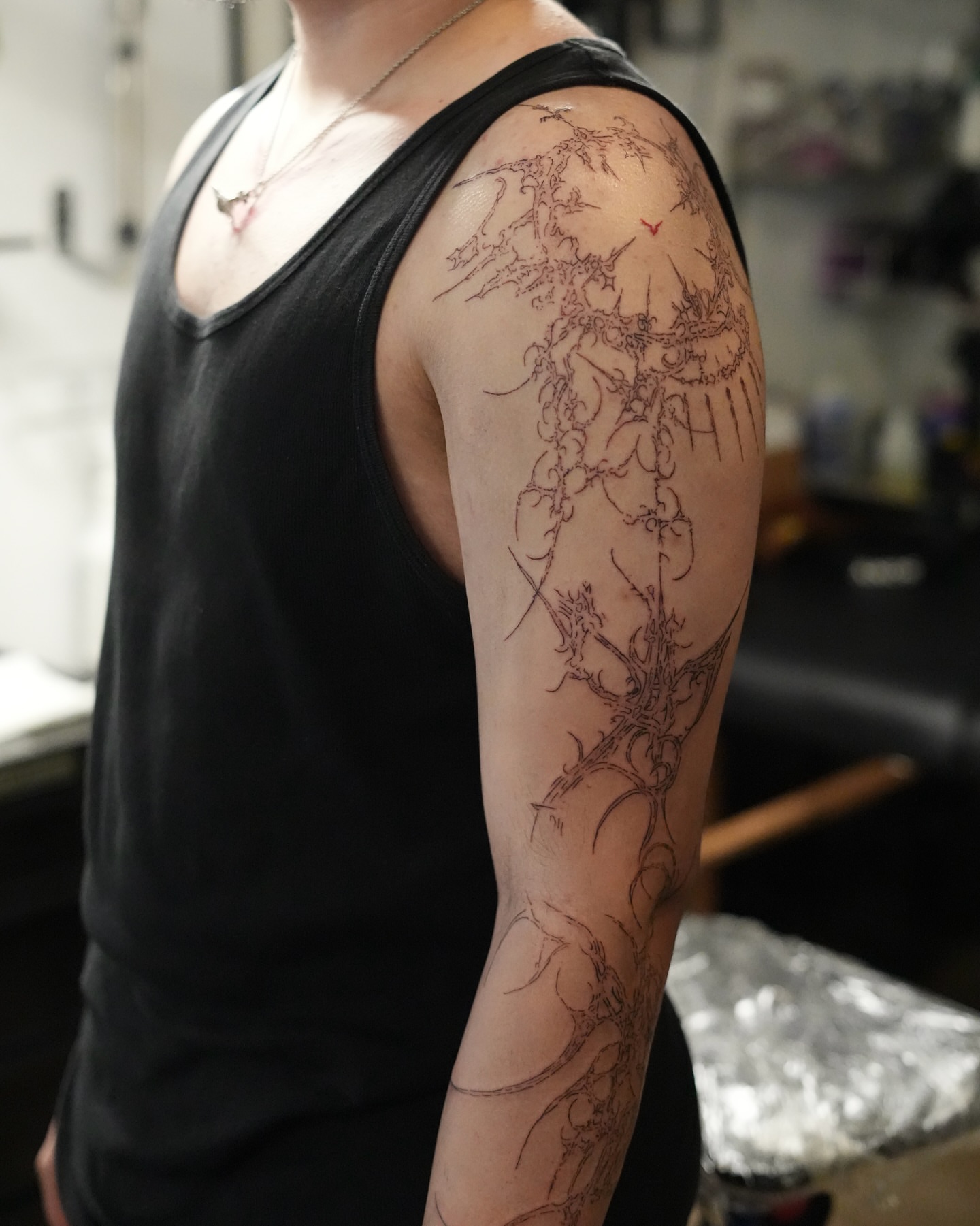 Abstract plant black and grey tattoo on the upper arm by alyssa ⋆₊ ♱