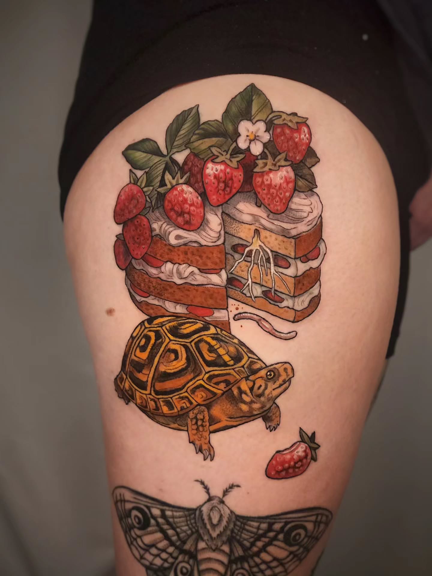 Strawberry shortcake and turtle dotwork tattoo on the thigh by Whitney Caskey