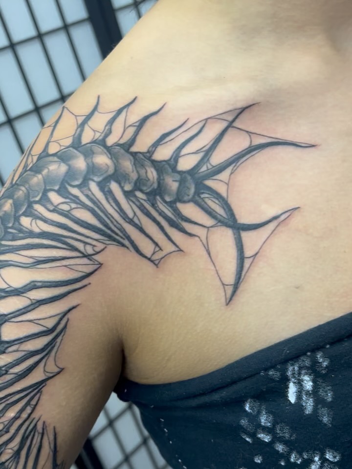 Centipede black and grey tattoo on the shoulder by Sav