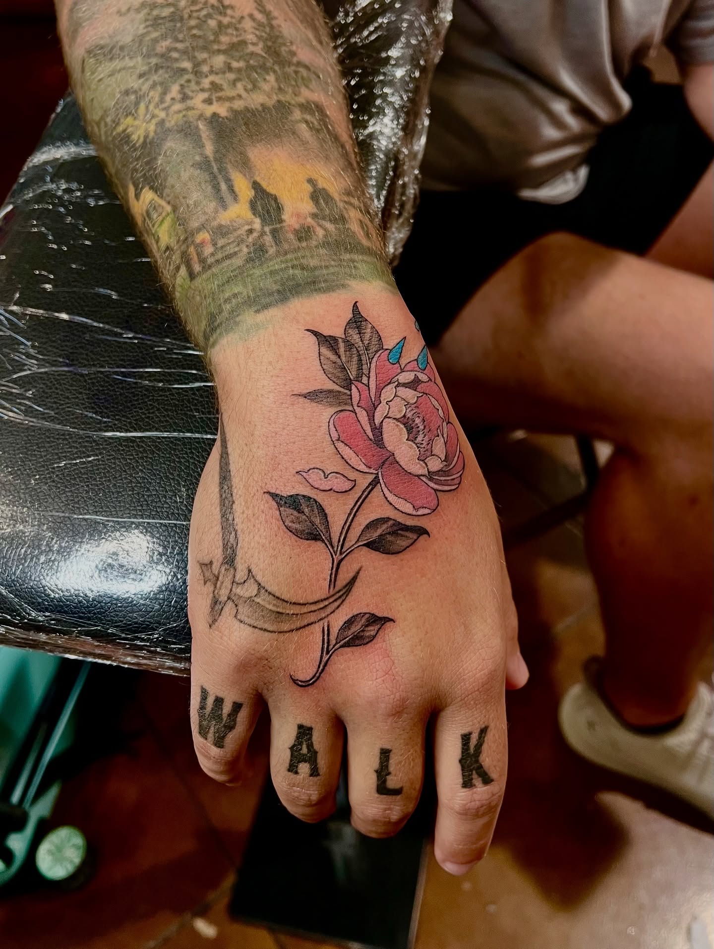 Flower and anchor realism tattoo on the hand by Joi Bailey, Denton, Texas