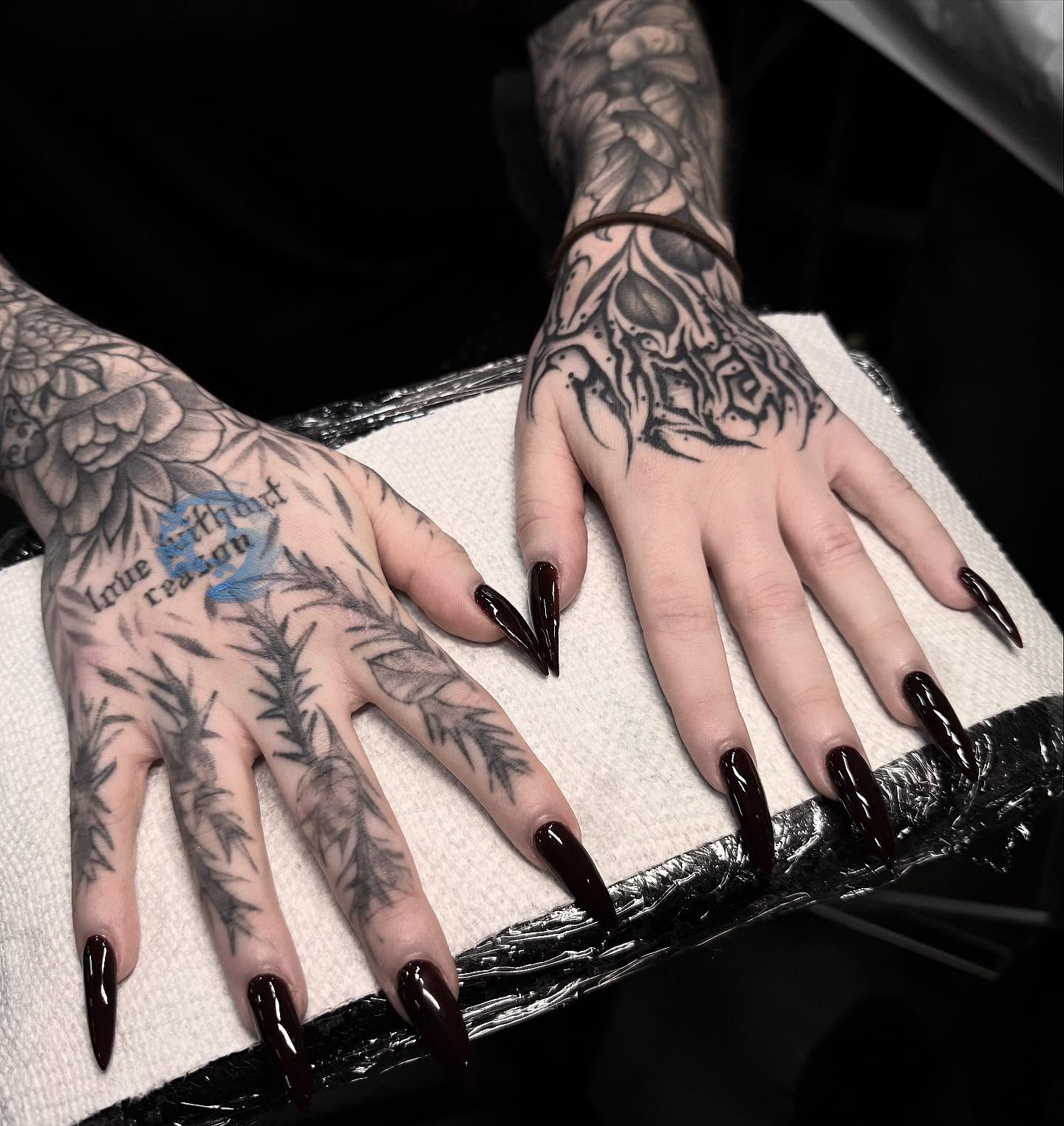 Dark floral pattern black and grey tattoo on the hand by miami tattoo artist