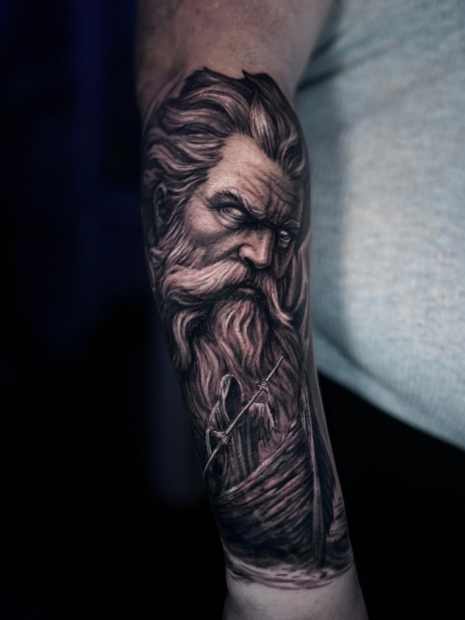 Bearded man realism tattoo on the forearm by Devin Mullen