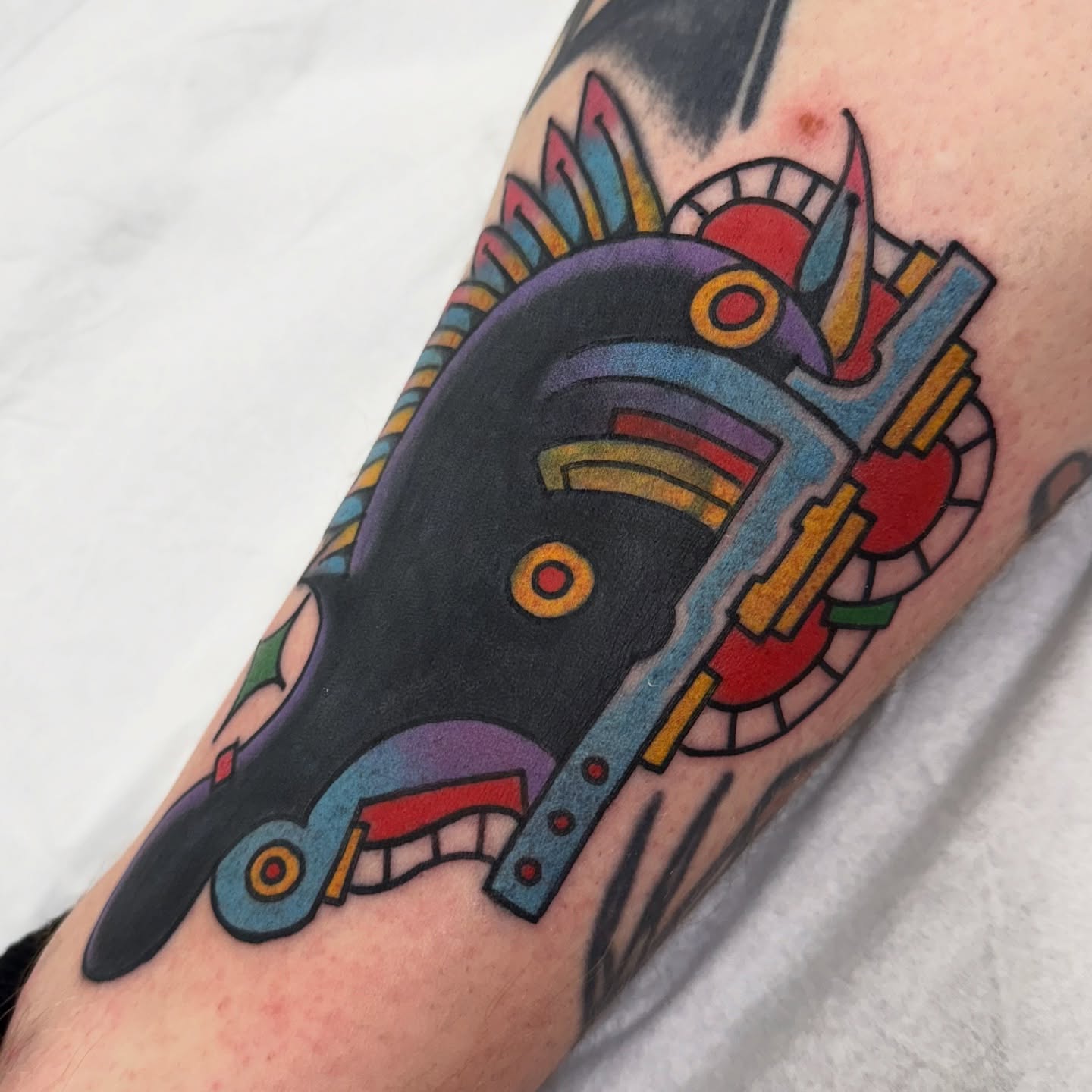 Robotic mask American traditional tattoo on the forearm by Chris Orta