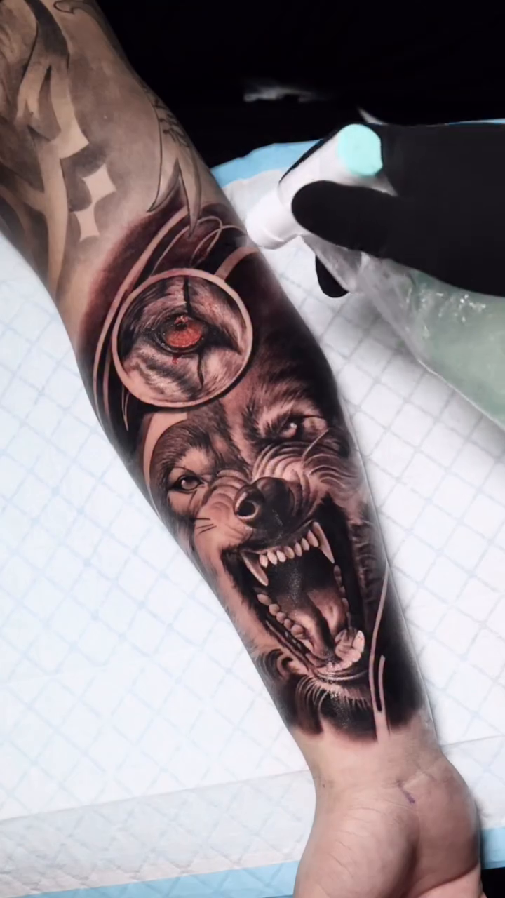 Wolf head with eye symbol realism tattoo by Ali Saleh 🇱🇧 Detroit Tattoo Artist, Dearborn, Michigan