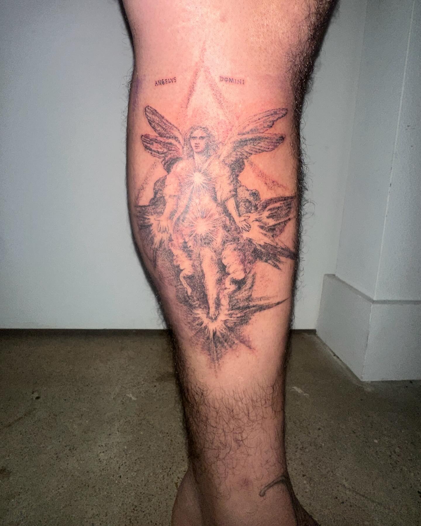 Angelic figure black and grey tattoo on the calf by Gregory Bramble Tattoo ๐ด๓ ง๓ ข๓ ฅ๓ ฎ๓ ง๓ ฟ