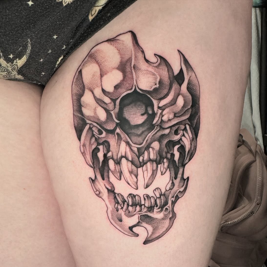 Flaming skull realism tattoo on the thigh by Ryan Futterman