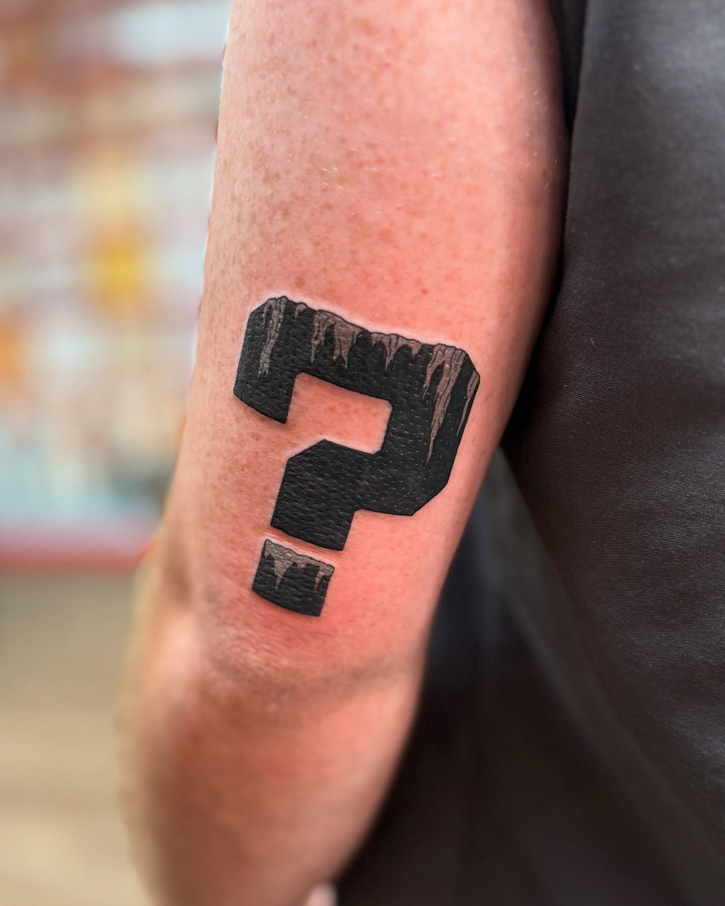 Question mark black and grey tattoo on the forearm by Justin Bianchini - New Orleans Tattoo Artist