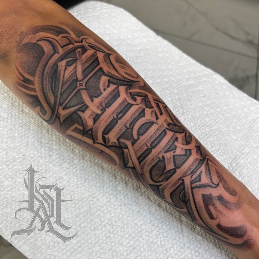 Gothic script lettering script tattoo on the forearm by Ashley brown, Las Vegas, Nevada