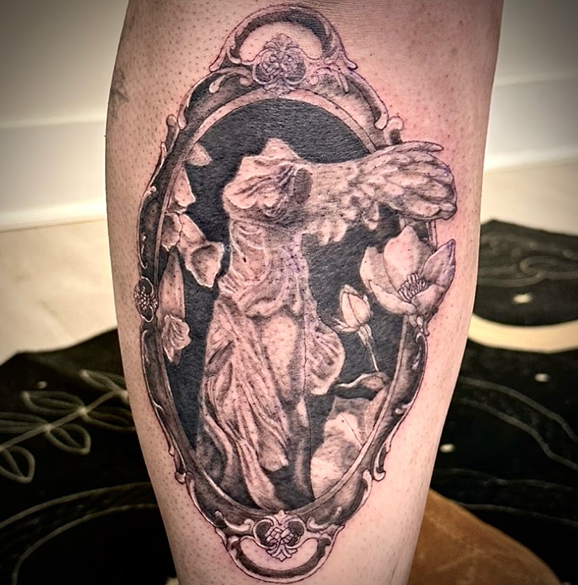 Statue with flowers realism tattoo on the forearm by 🌜🔮✨Anya Casey✨🔮🌛