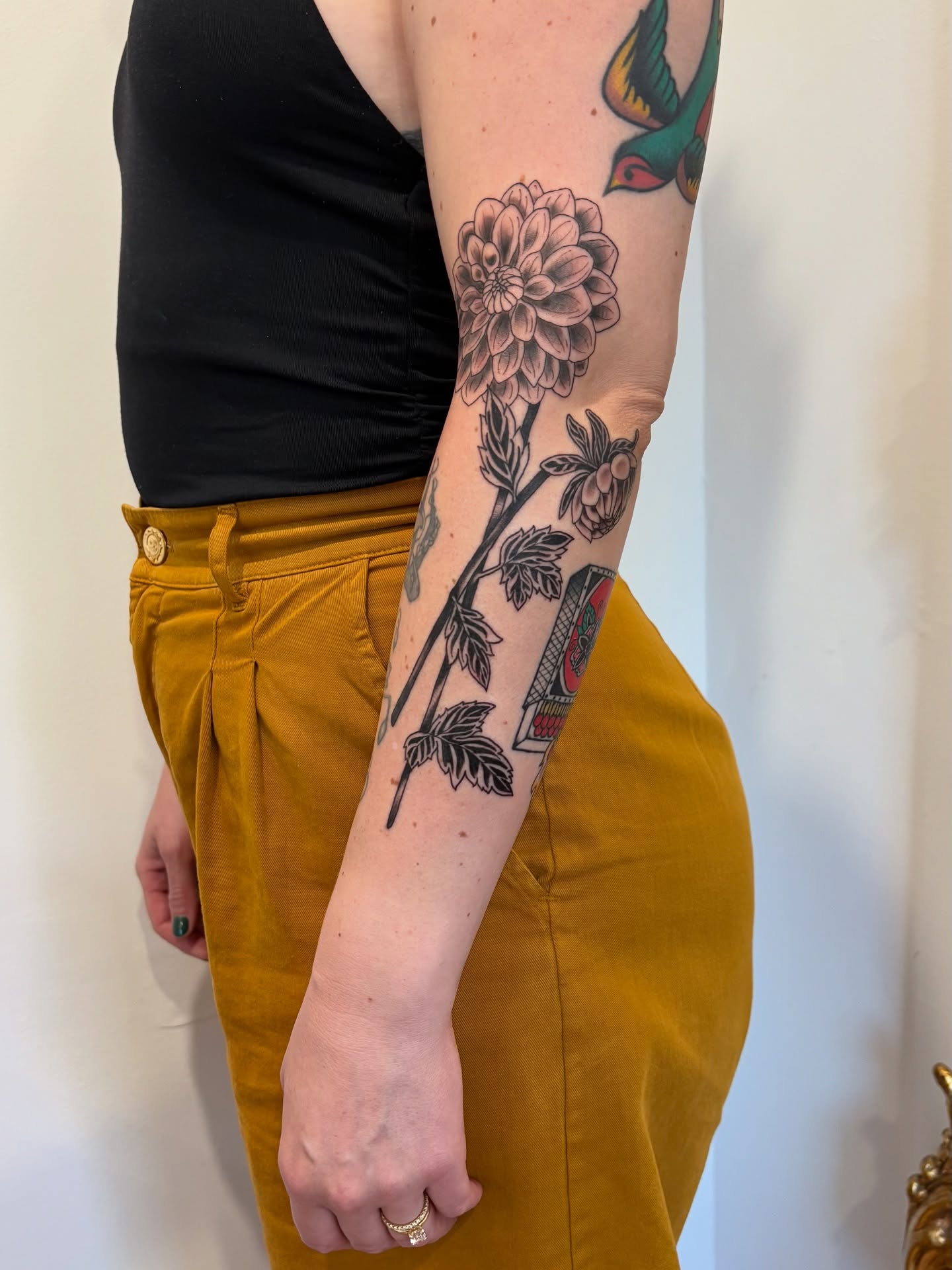 Flower and bird black and grey tattoo on the forearm by 𝓰𝓲𝓷𝓪 𝓼𝓮𝓻𝓹𝓮𝓷𝓽𝓲𝓷𝓪