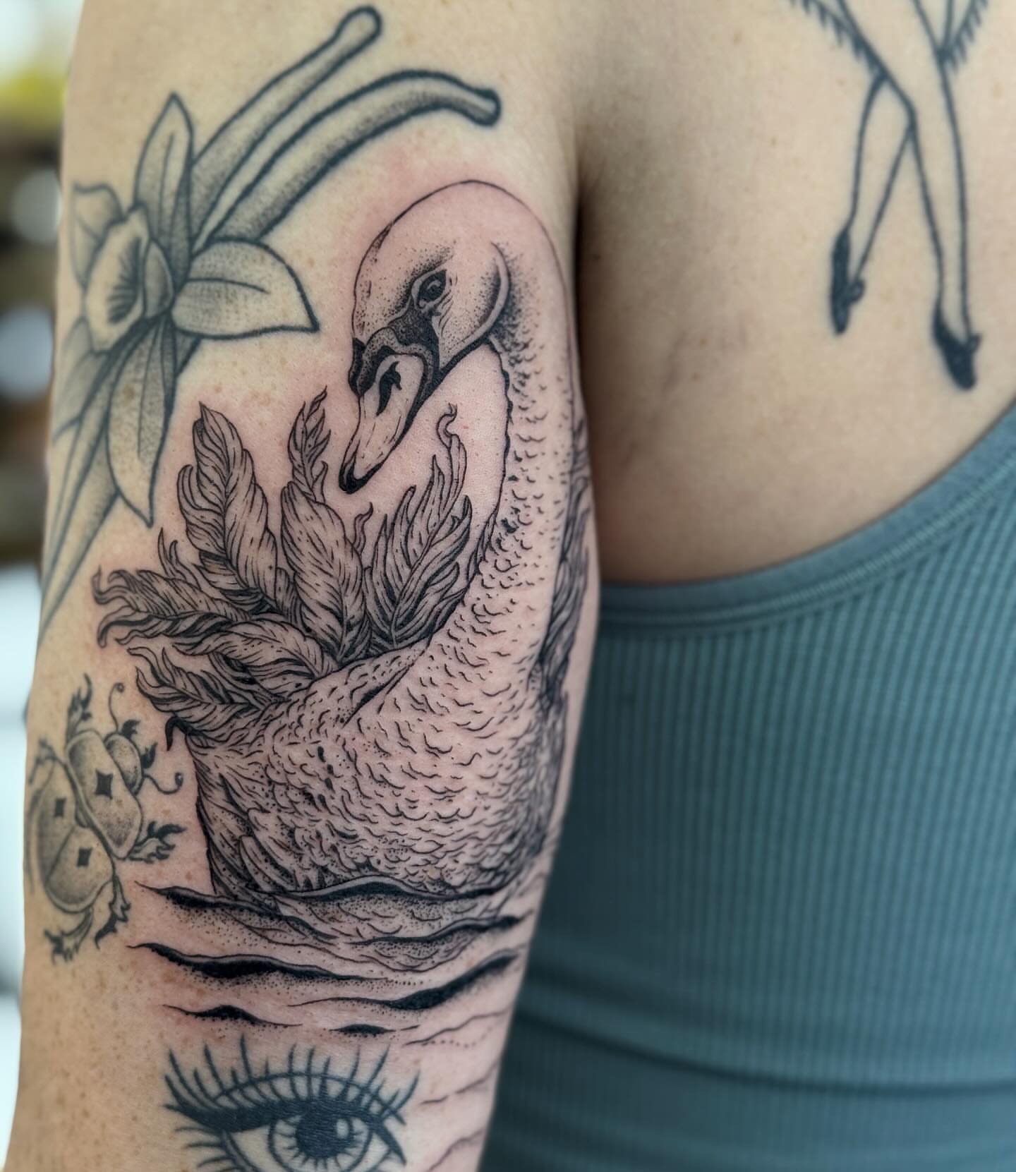 Swan dotwork tattoo on the upper arm by Writhe Grey