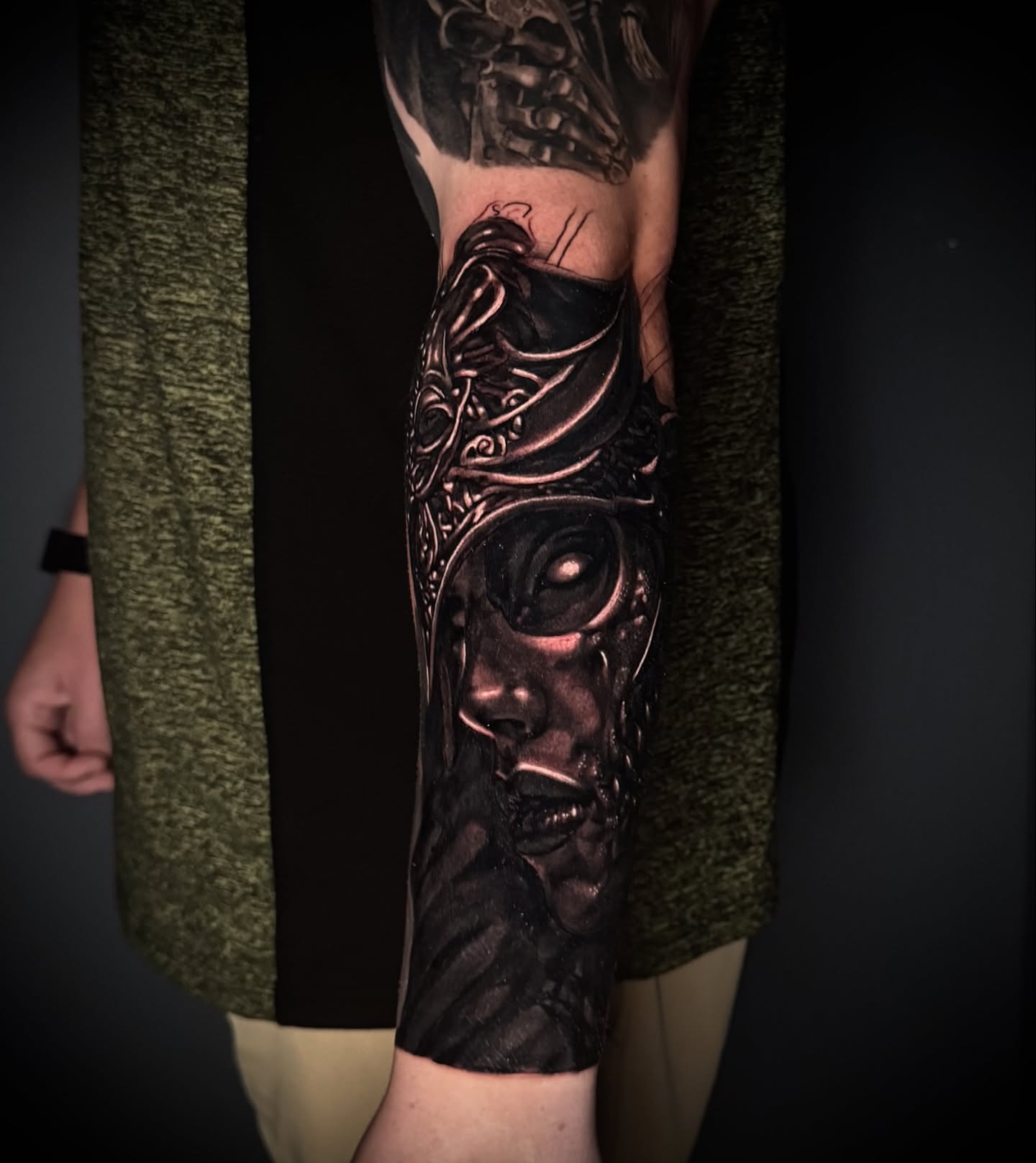 Mask dark realism tattoo on the forearm by Lindsey Lane, Dallas, Texas