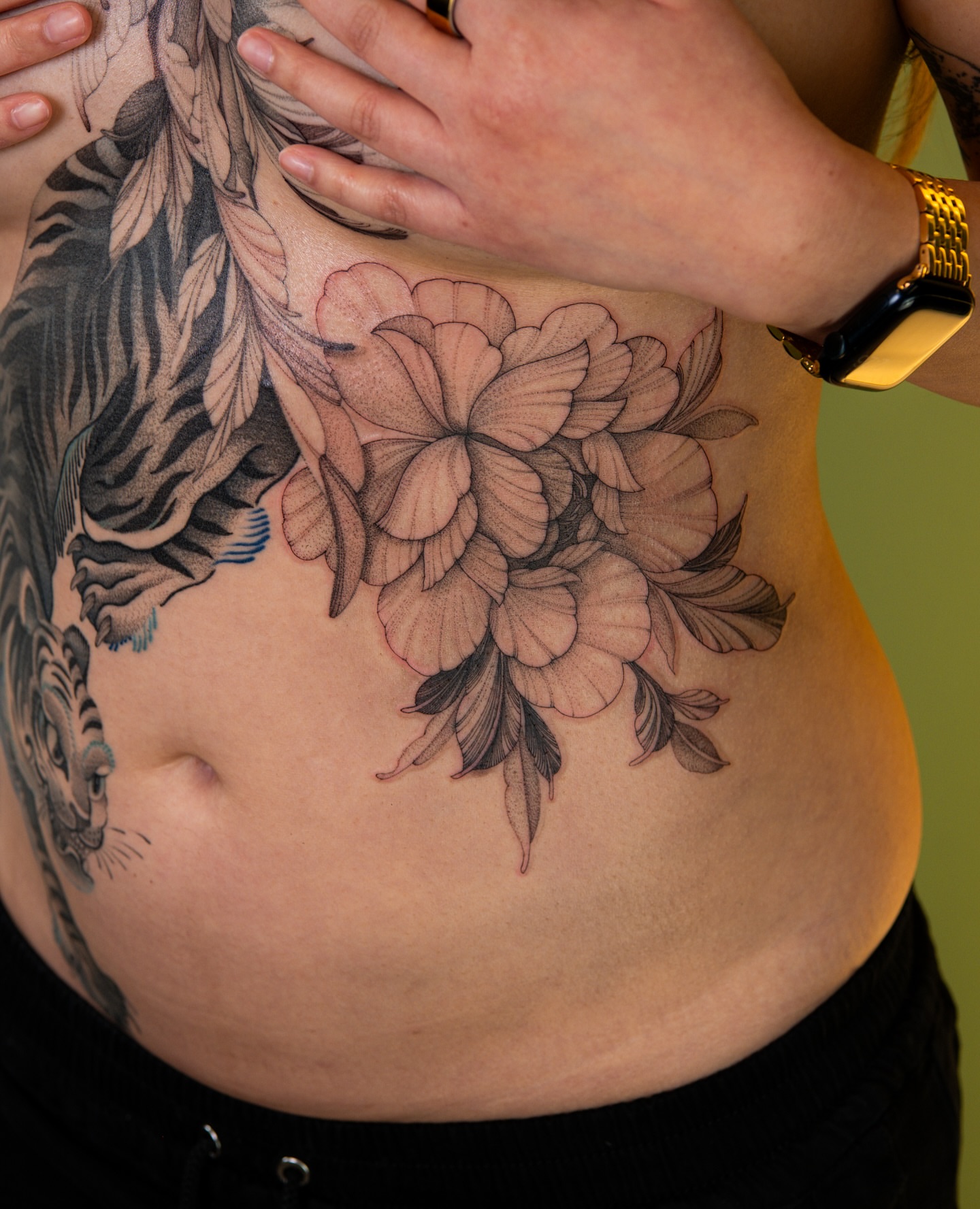 Peony flowers black and grey tattoo on the torso by Flower Tattoo Sf