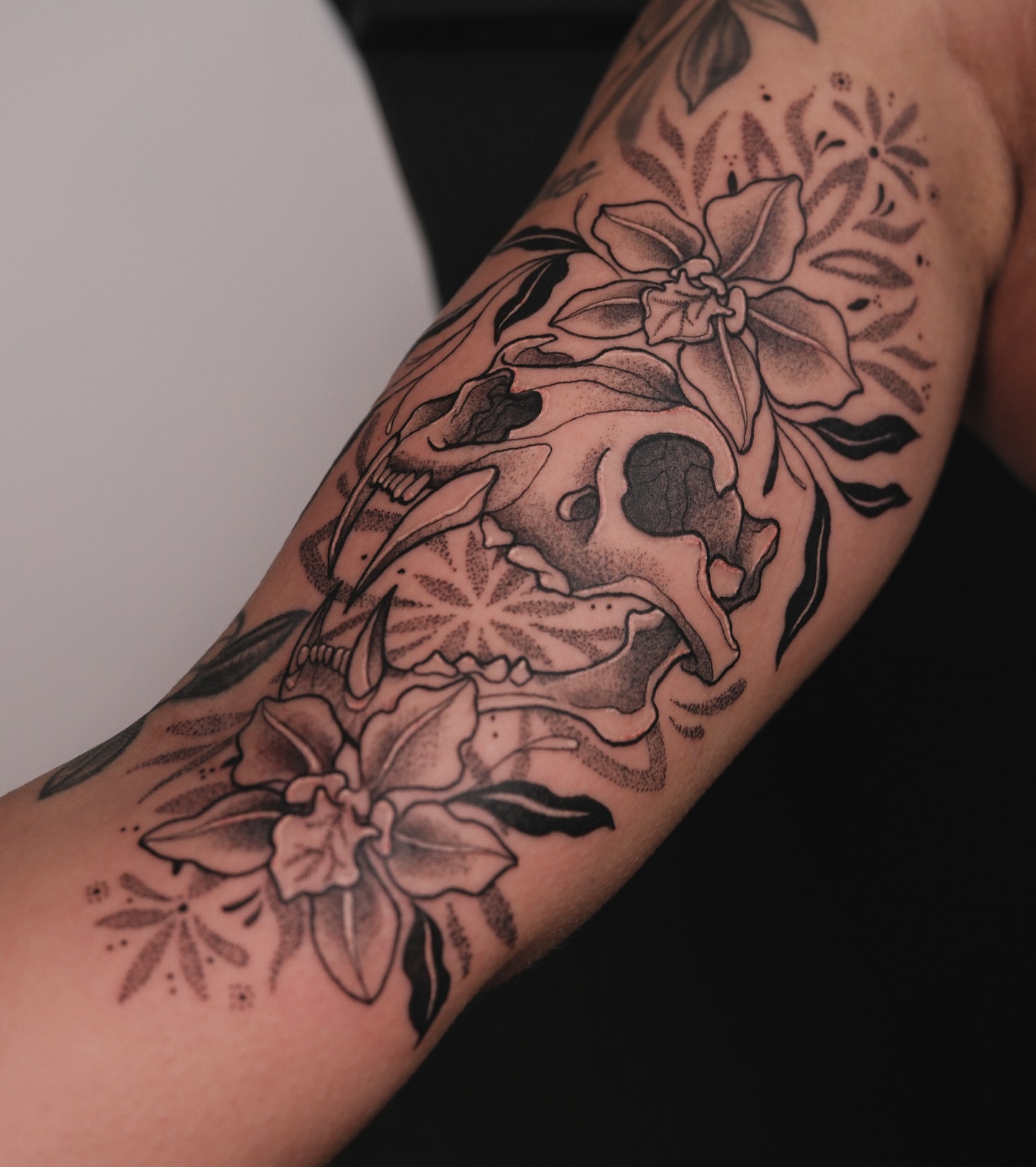 Floral arrangement dotwork tattoo on the forearm by Velvet, Seattle, Washington