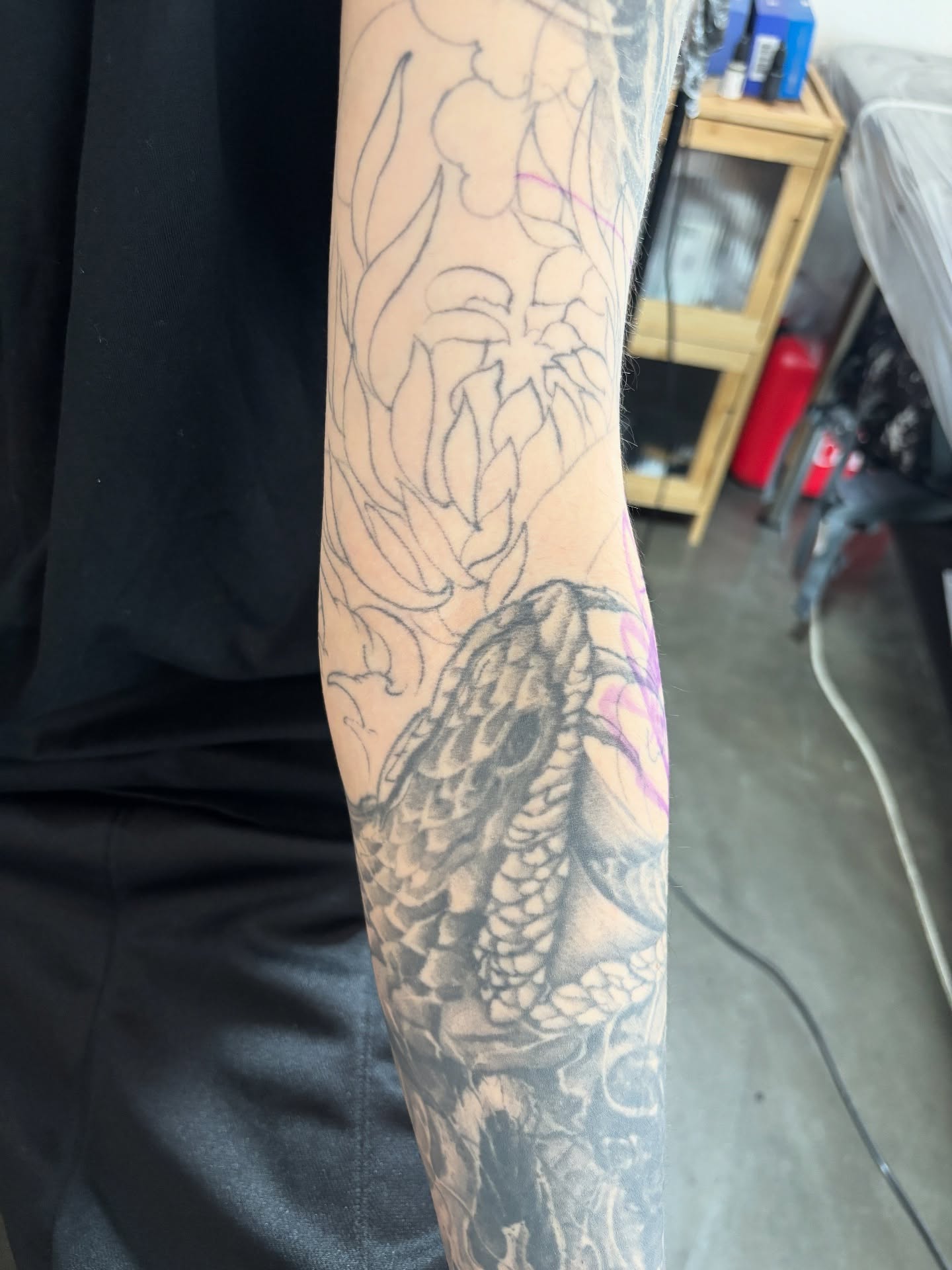 Snake and leaves black and grey tattoo on the forearm by Dark tattoo