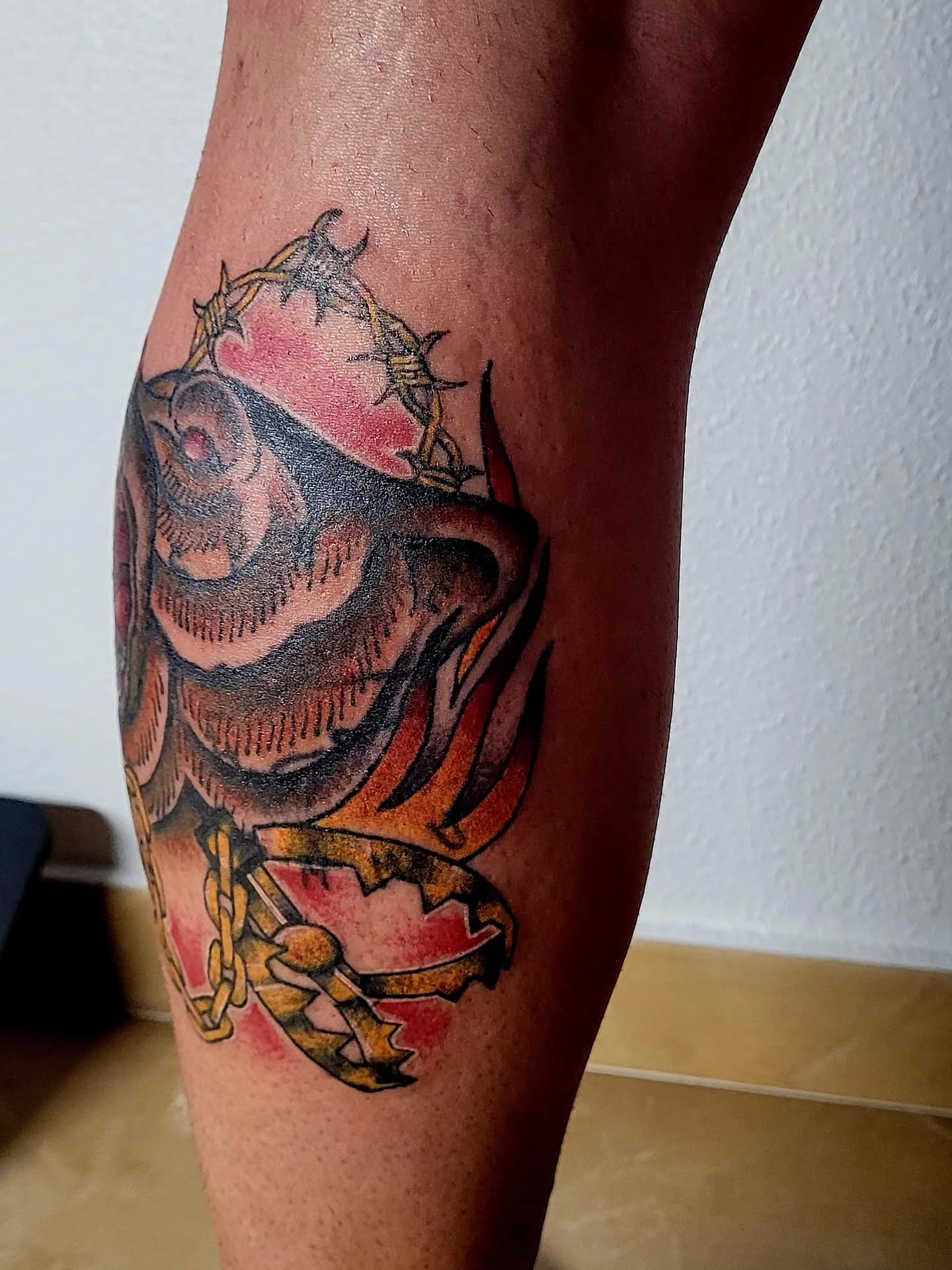 Skull with barbed wire crown American traditional tattoo on the calf by Gonzalo Pantona