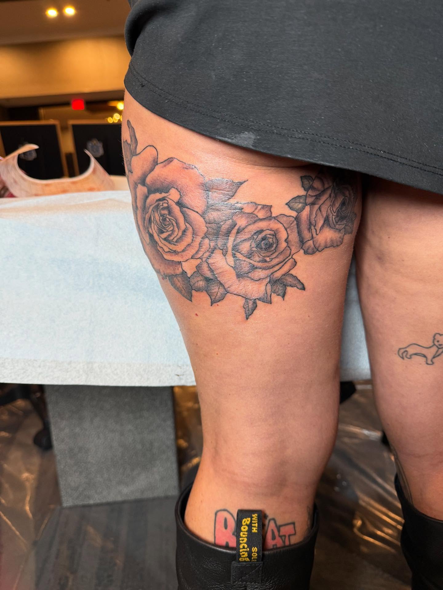 Roses black and grey tattoo on the thigh by Sai Machain
