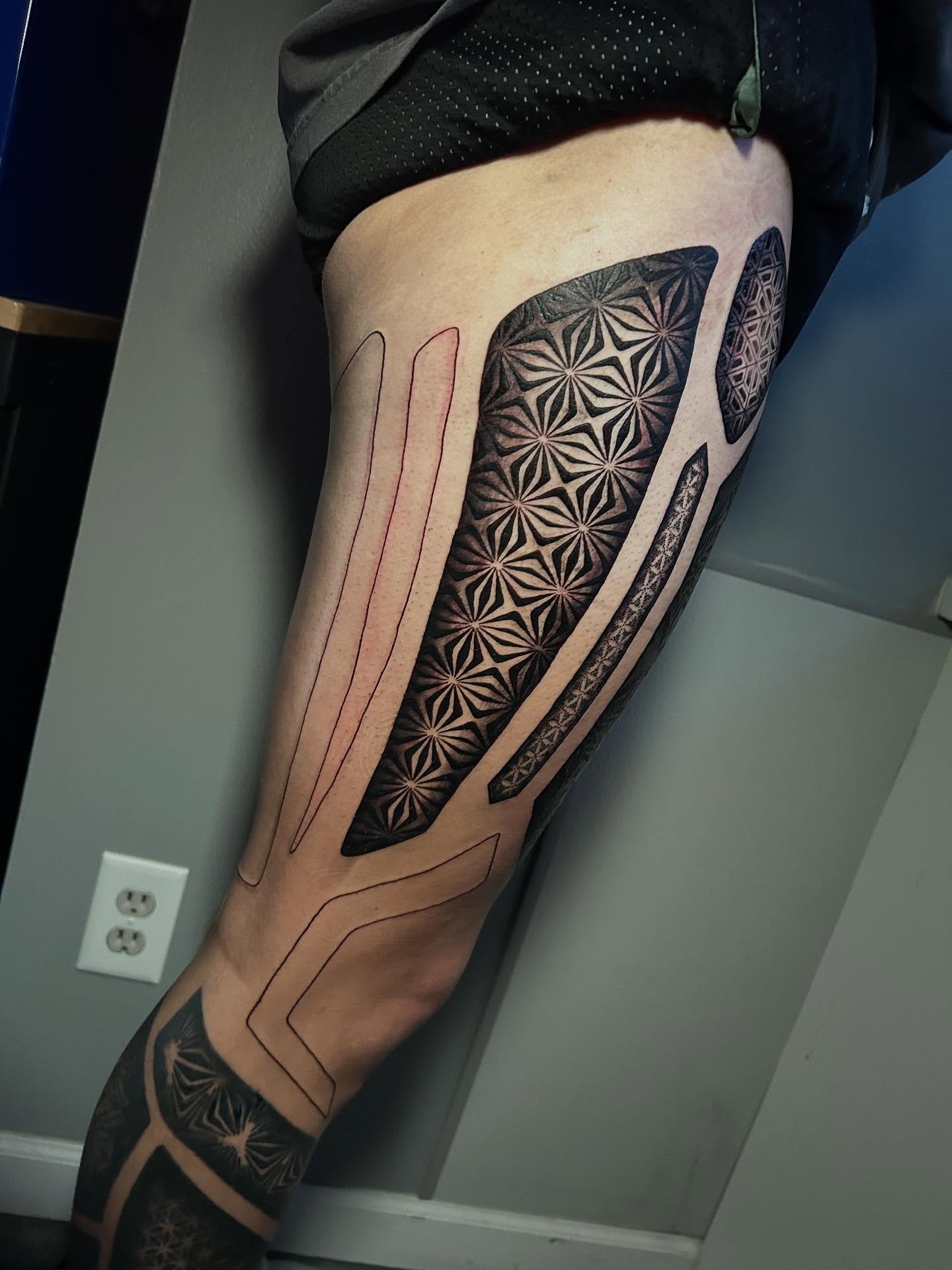 Geometric pattern geometric tattoo on the thigh by Adrian Michigan Tattoo Artist