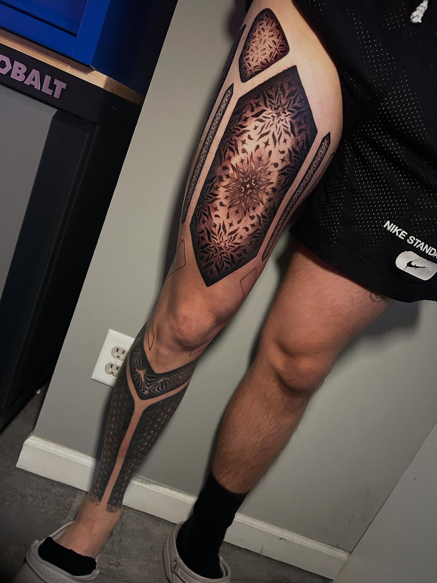 Geometric pattern geometric tattoo on the leg by Adrian Michigan Tattoo Artist