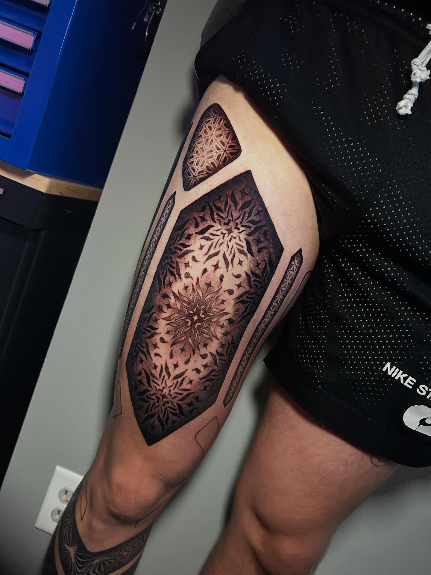 Geometric mandala geometric tattoo on the calf by Adrian Michigan Tattoo Artist