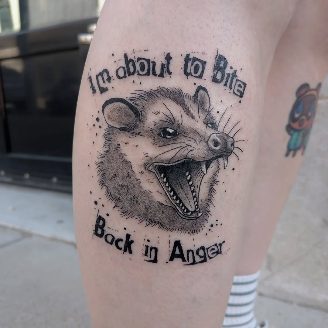 Opossum with text realism tattoo on the thigh by Damon 🥀