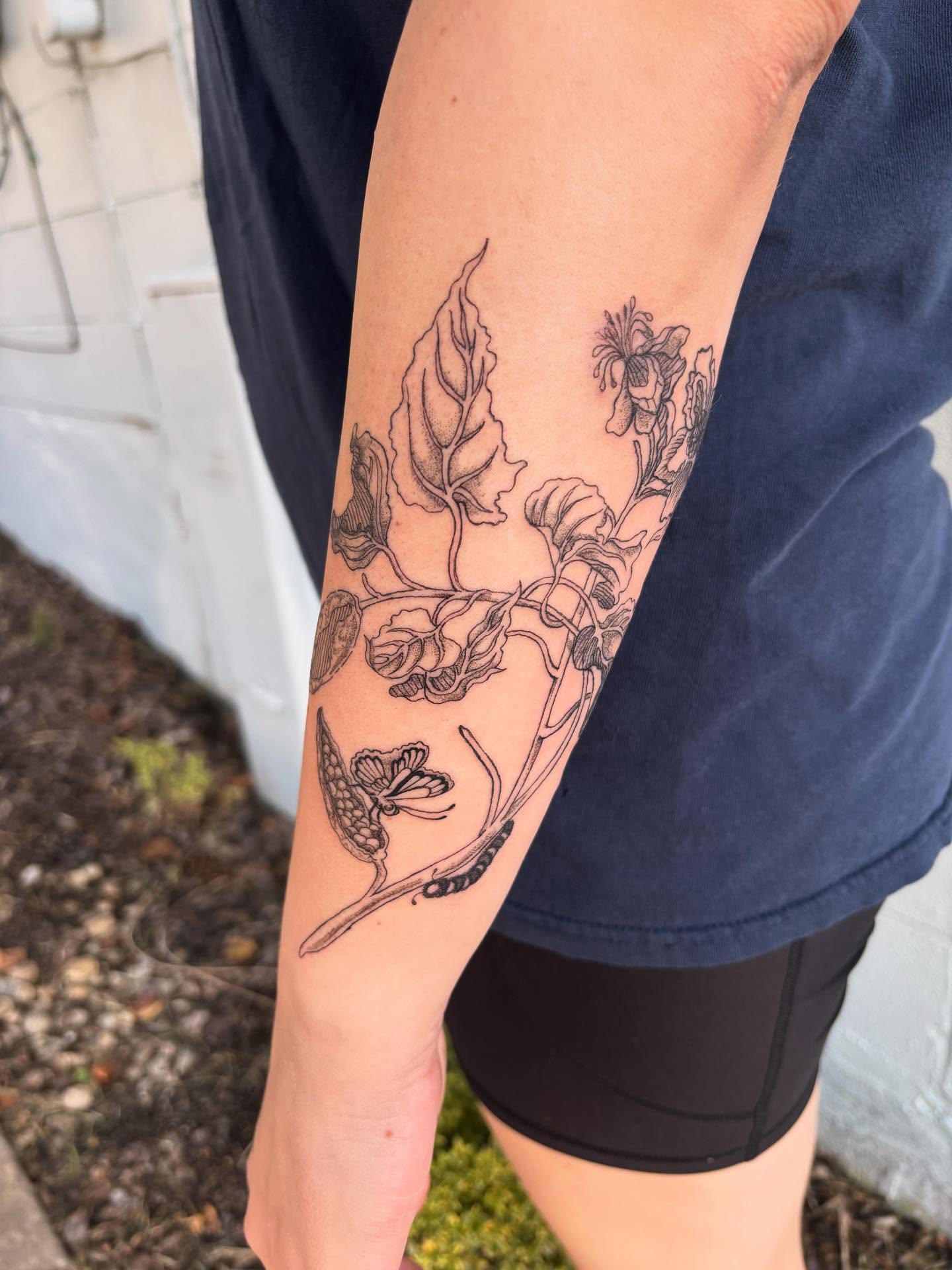 Botanical black and grey tattoo on the forearm by Ashley Ellerman
