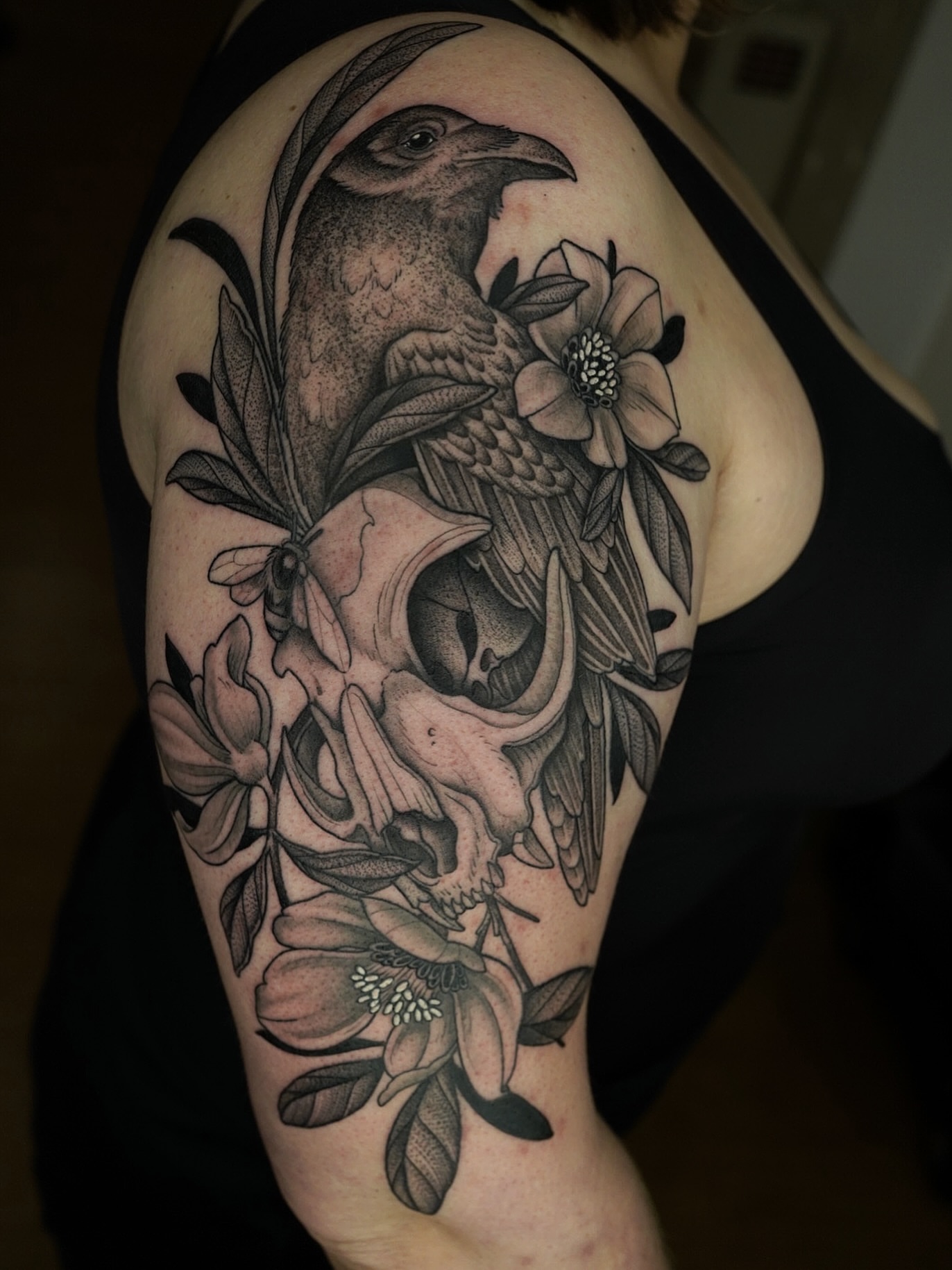 Skull and bird realism tattoo on the shoulder by Kyle Stacher - Blackwork Tattoos - Denver