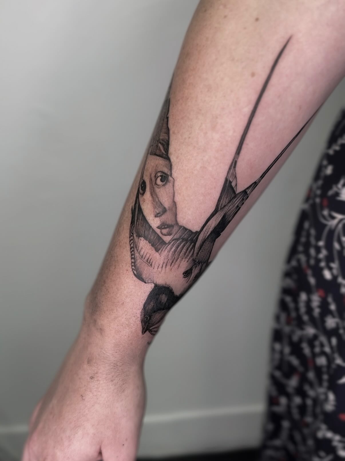 Swallow and woman's face realism tattoo on the forearm by Rachel