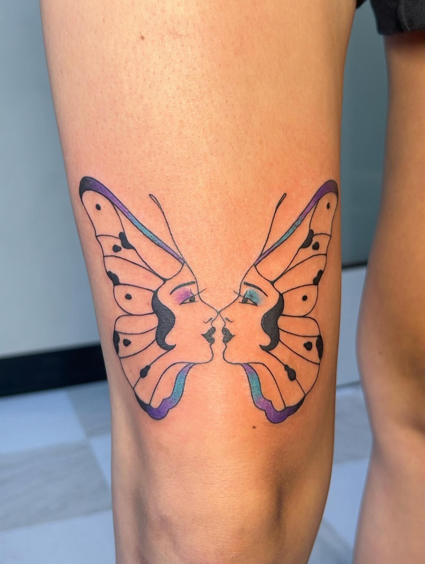 Butterfly couple dotwork tattoo on the thigh by kuna ink
