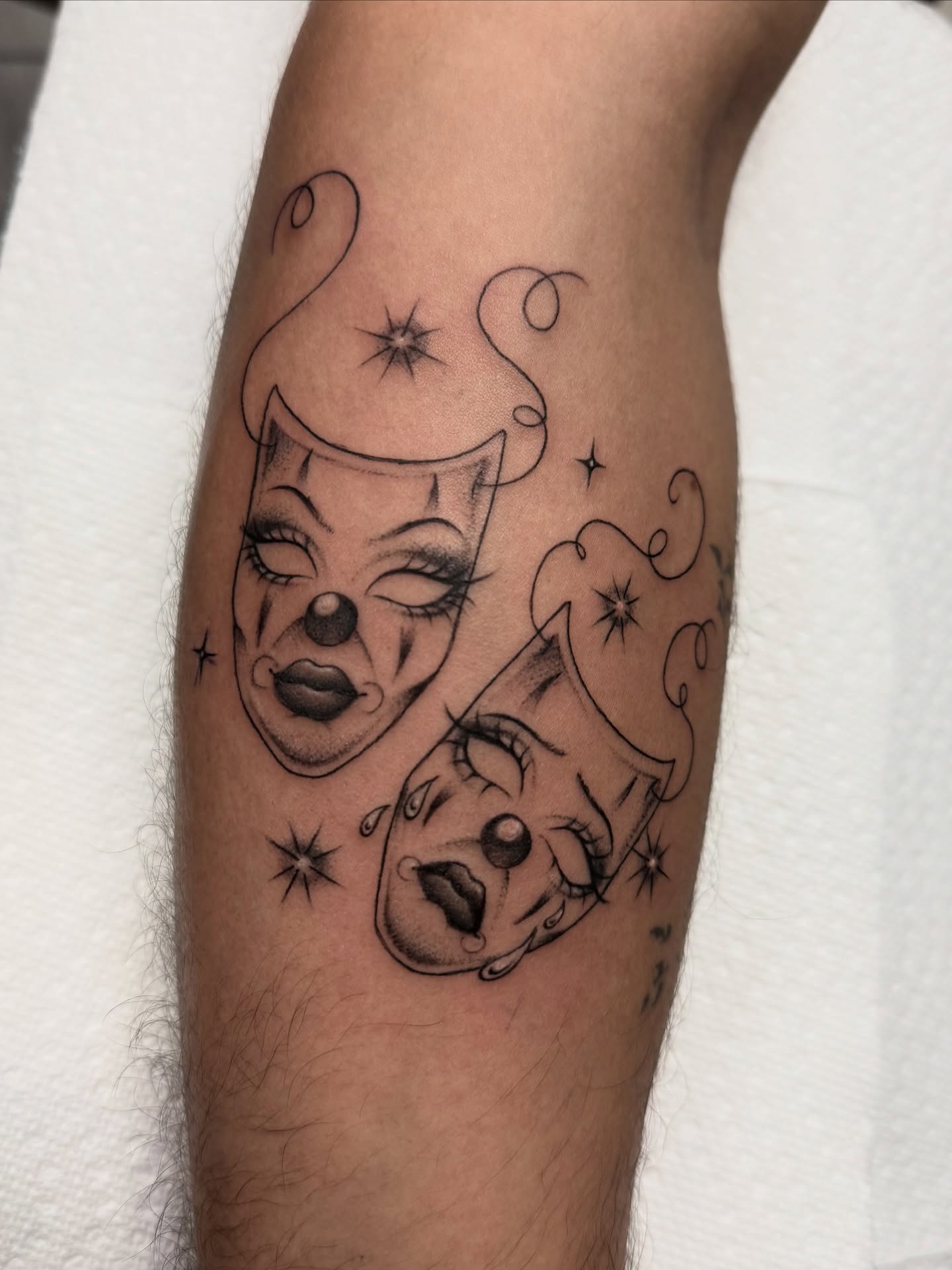 Clown masks black and grey tattoo on the forearm by dinah