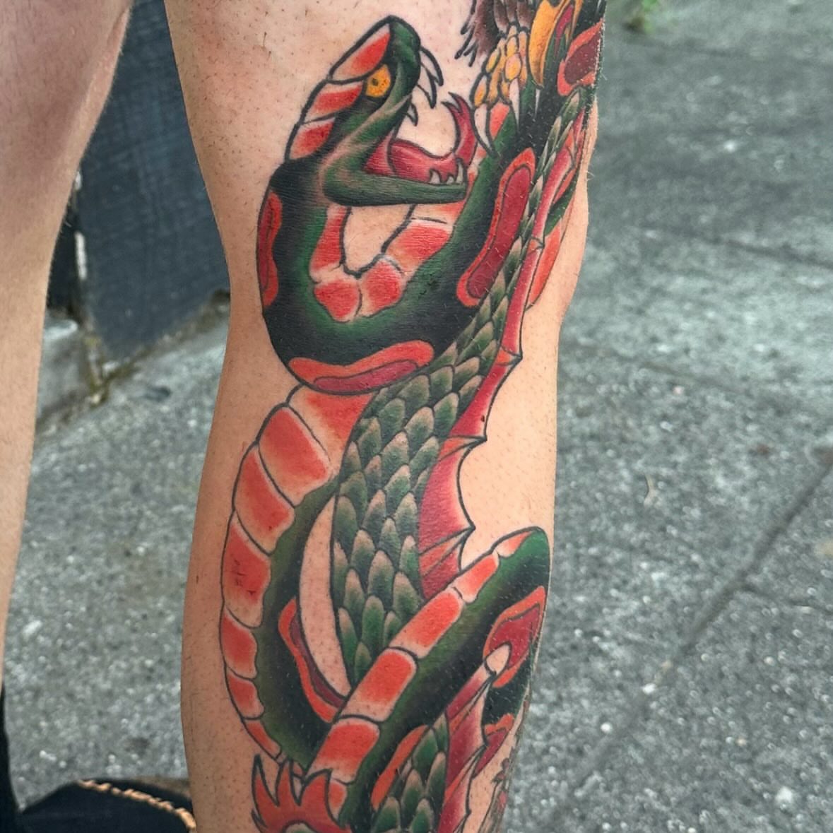Snake American traditional tattoo on the forearm by Alan