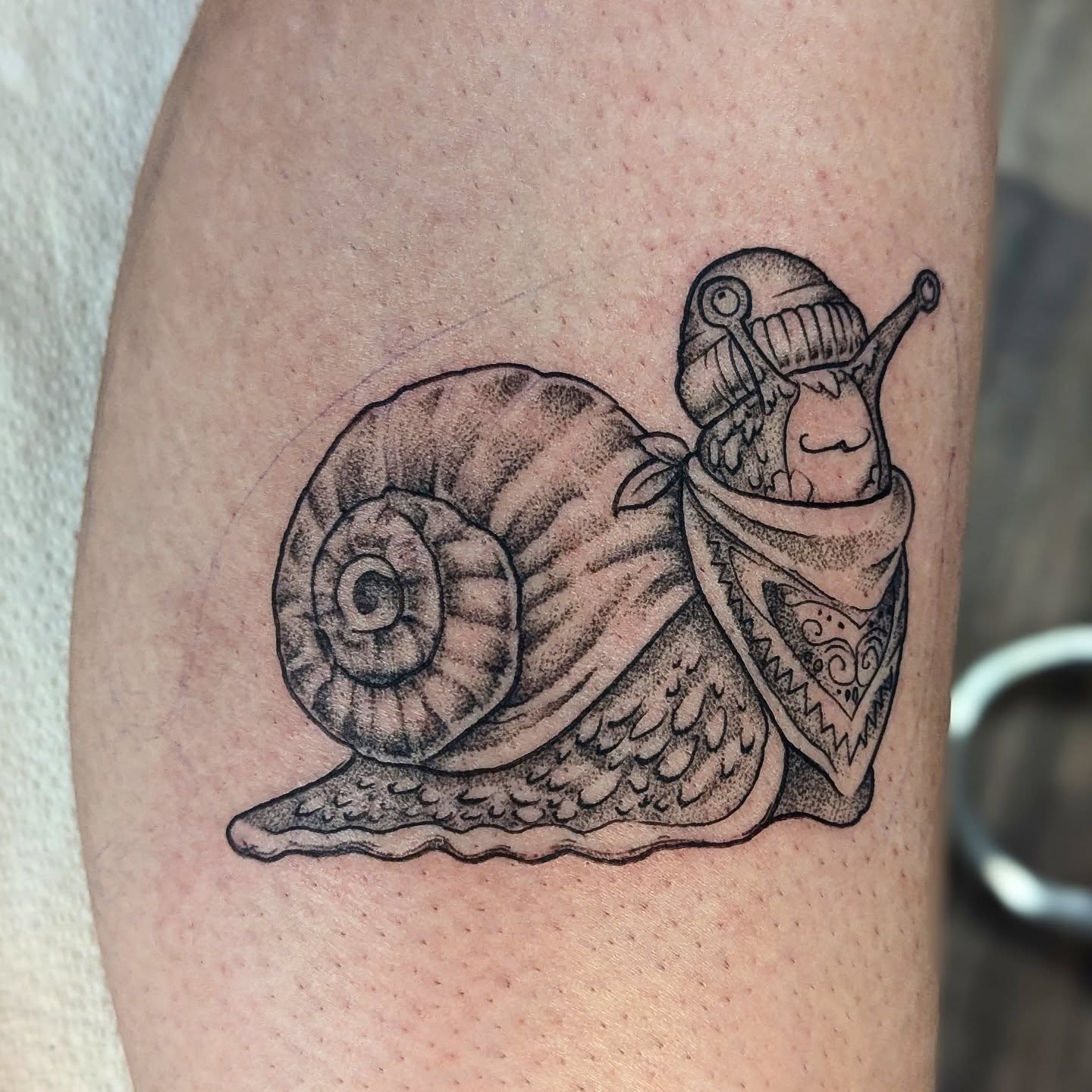 Snail with robot head dotwork tattoo on the forearm by DONEL 📍Denver