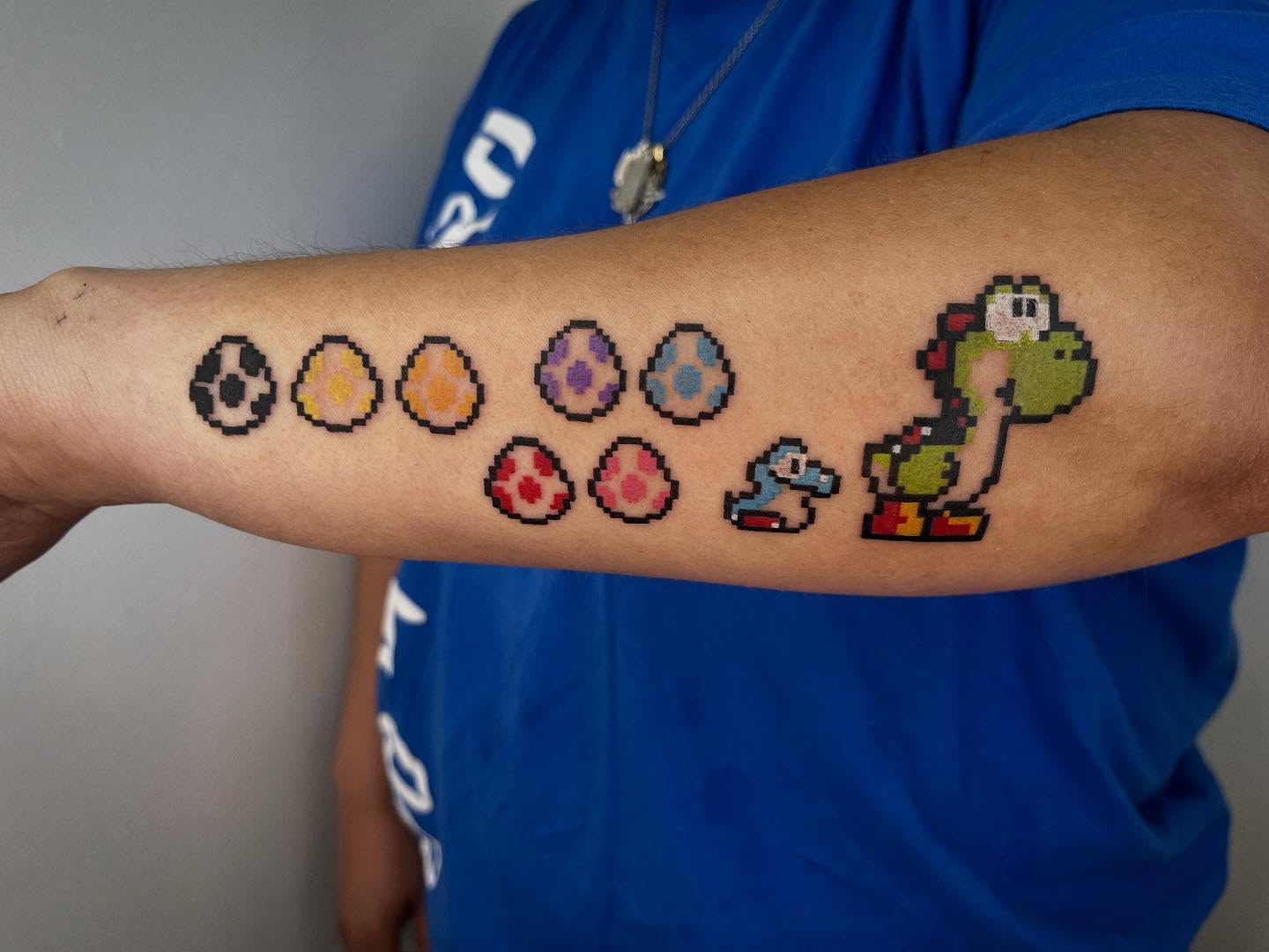 Yoshi and eggs dotwork tattoo on the forearm by Peach ๐, Portland, Oregon