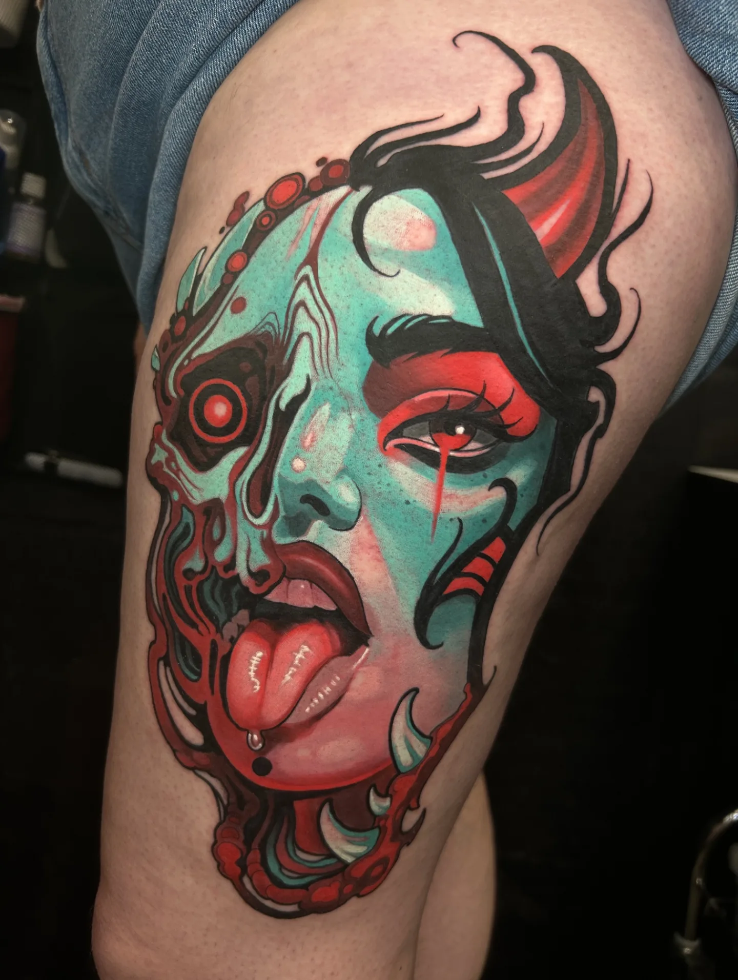 Woman's face American traditional tattoo on the thigh by Freddie Brown, Lombard, IL