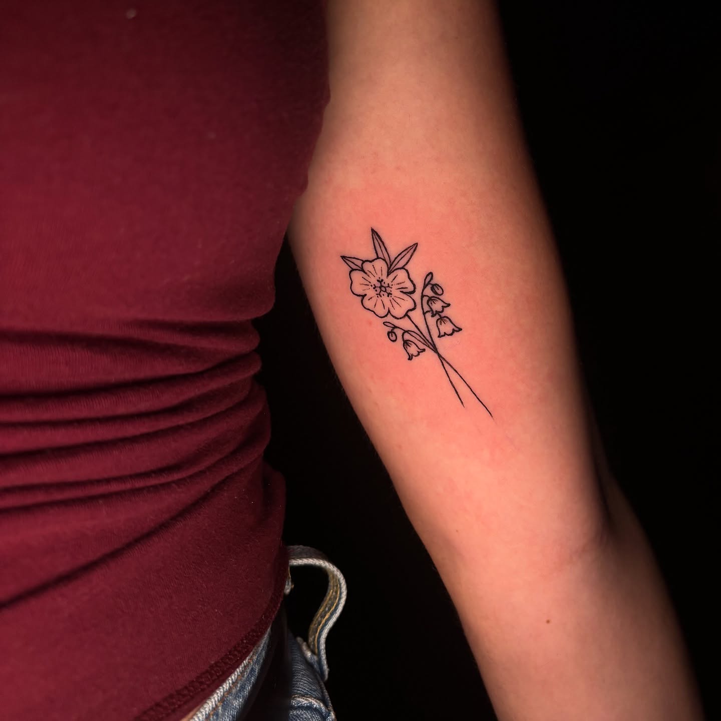 Flower bouquet fine line tattoo on the forearm by Rachel