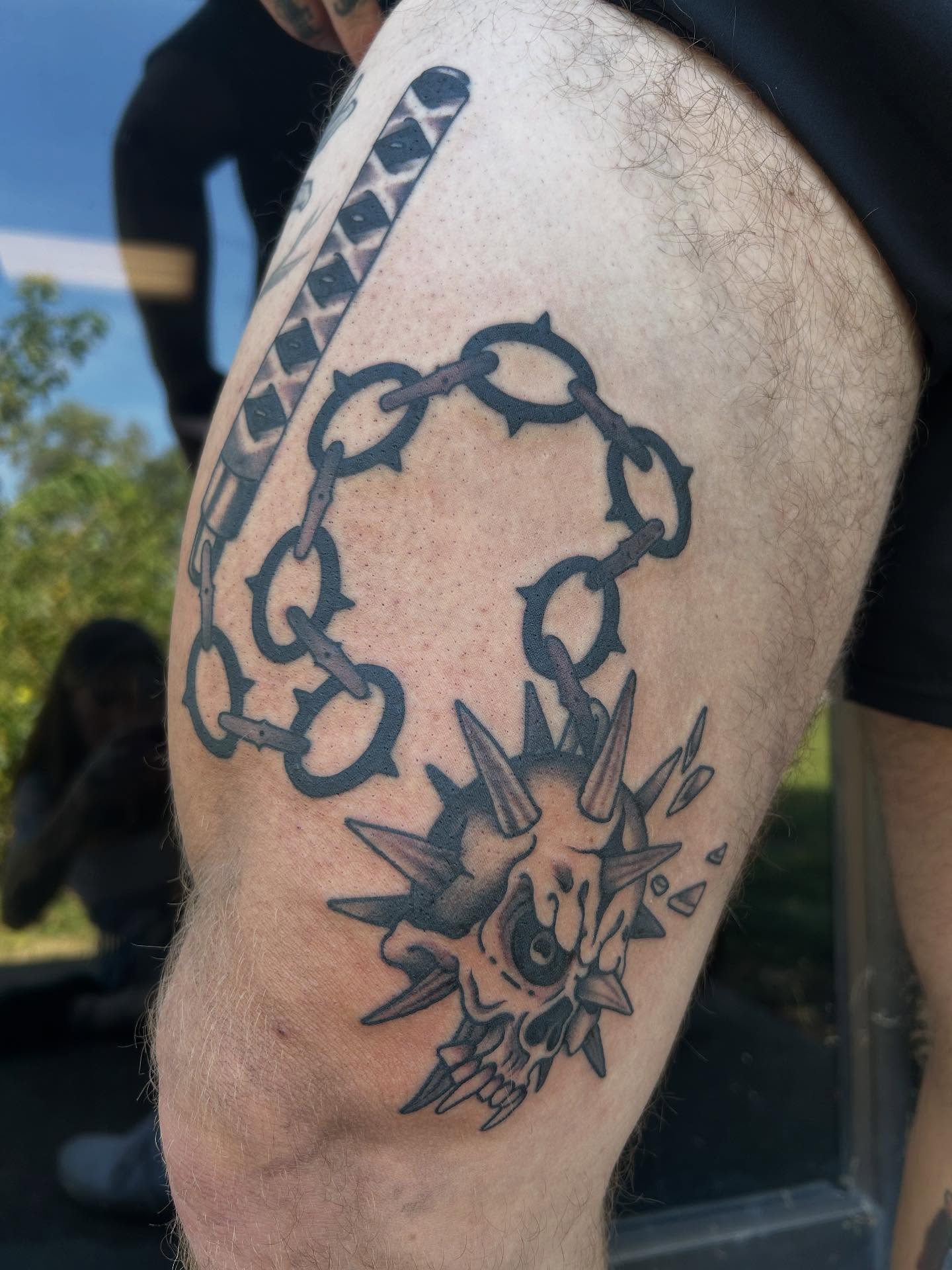 Chains and skull black and grey tattoo on the thigh by Katie Dexter, Des Moines, Iowa
