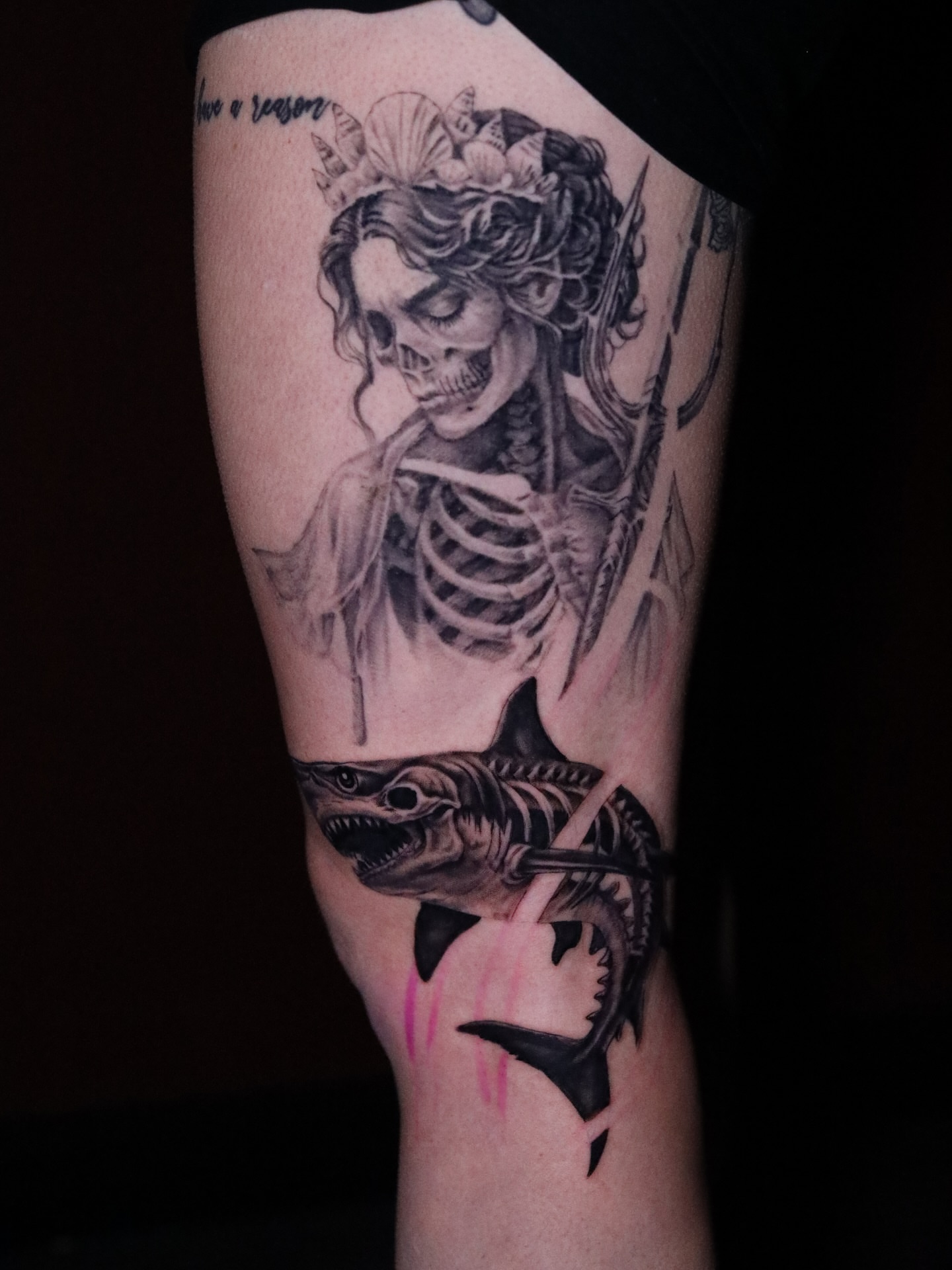 Skeleton with fish realism tattoo on the forearm by Neeko