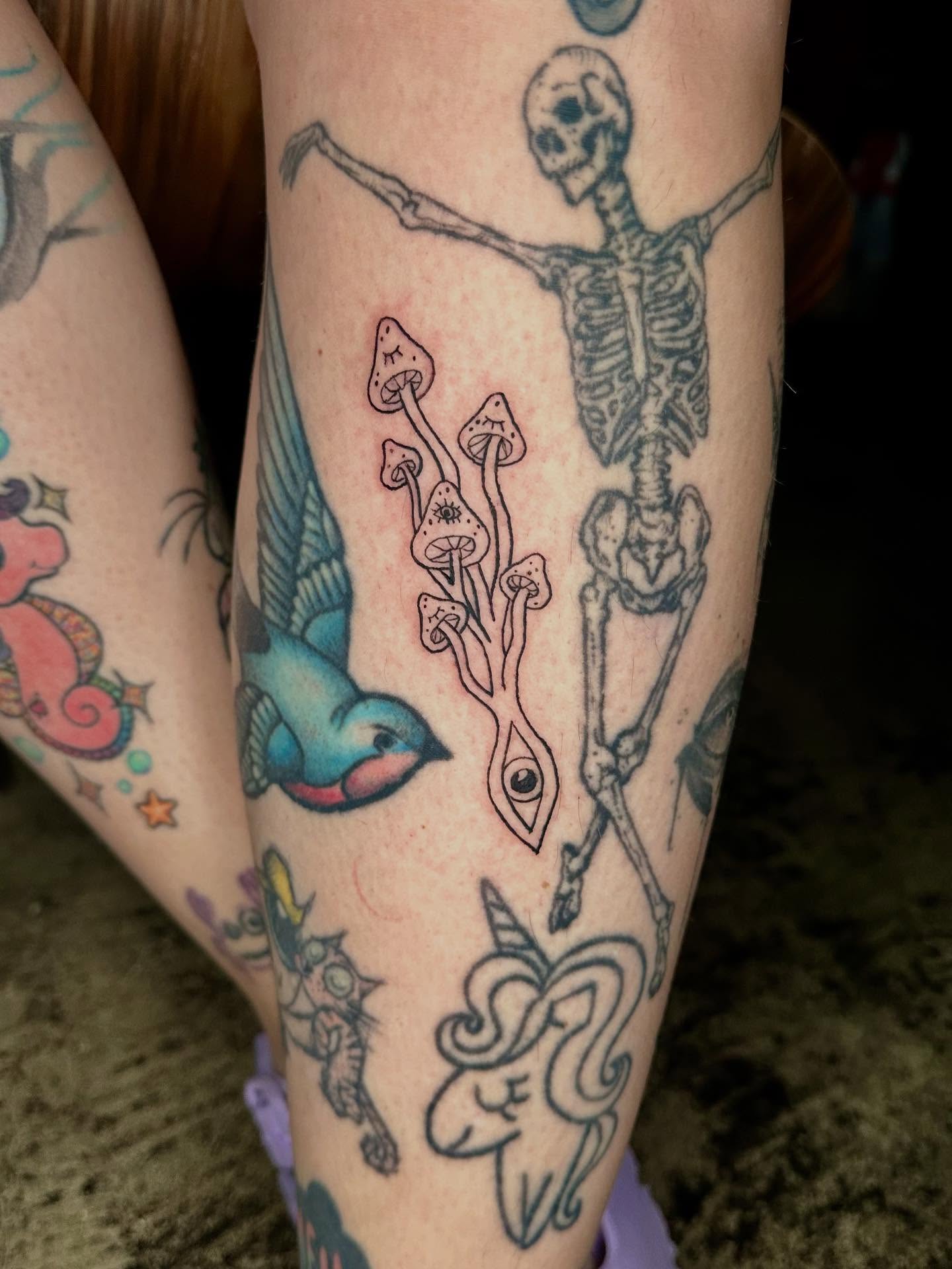 Skeleton and mushrooms American traditional tattoo on the forearm by Jadelin, San Francisco, California