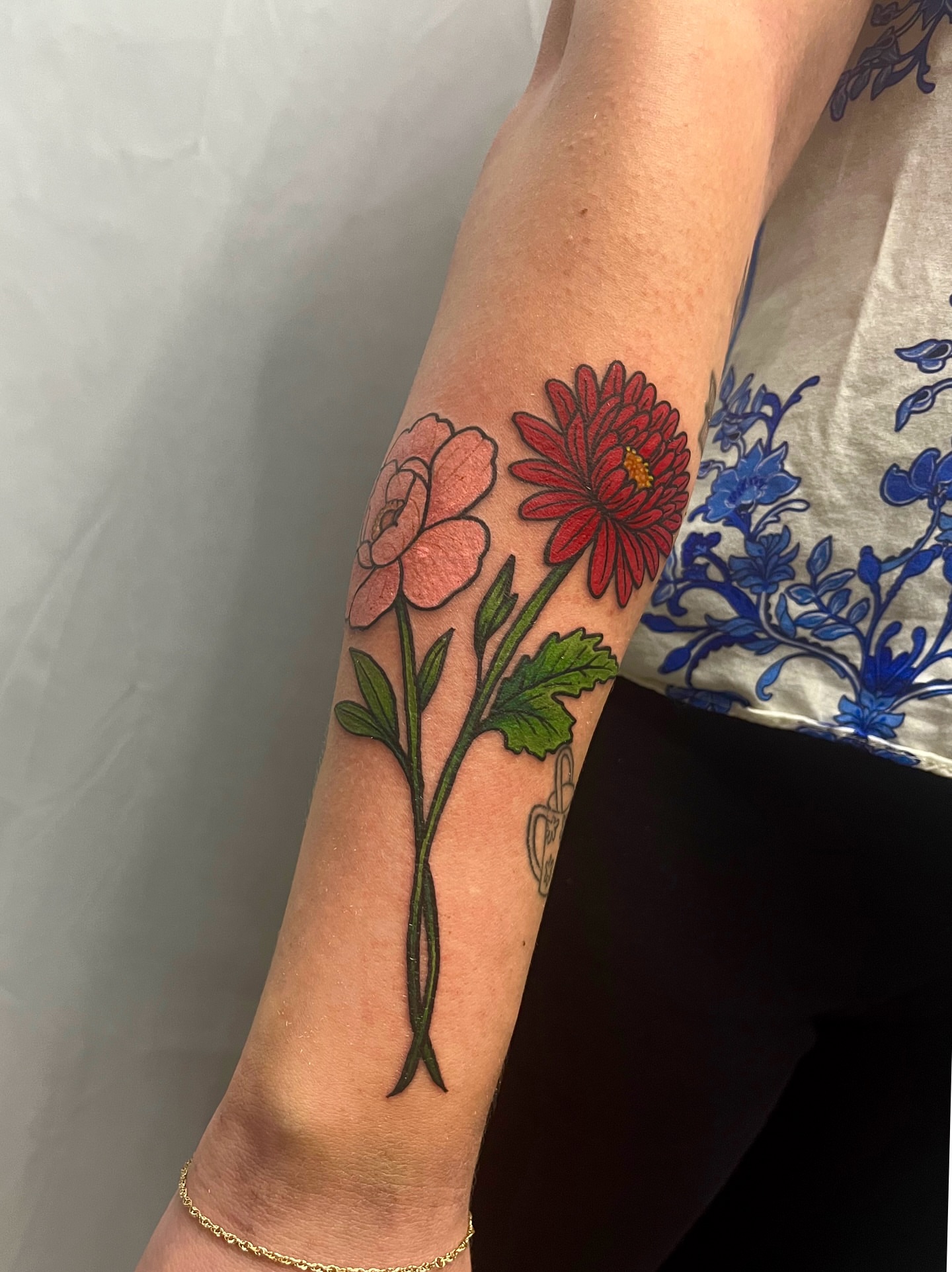 Flowers realism tattoo on the forearm by Ryan Hindenach