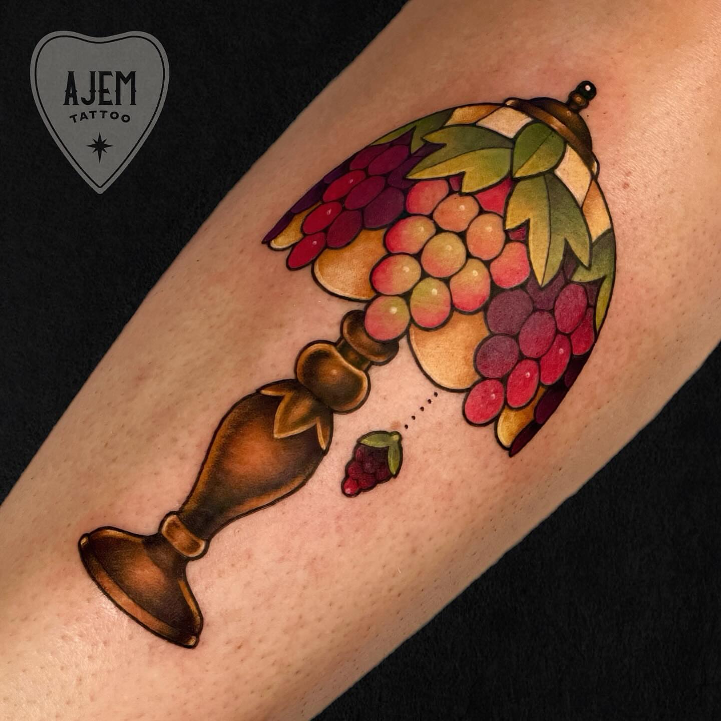 Grapes and wine glass realism tattoo on the forearm by Ash MacIsaac