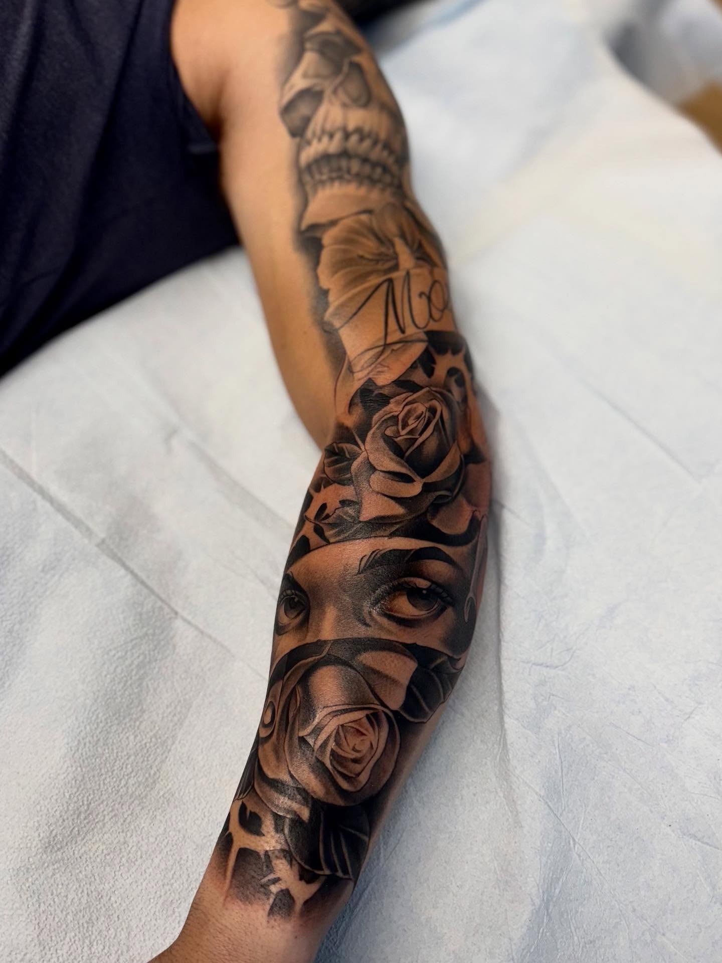 Woman's face with roses realism tattoo on the forearm by Bryan ๐ฅ Loggins, Baton Rouge, Louisiana