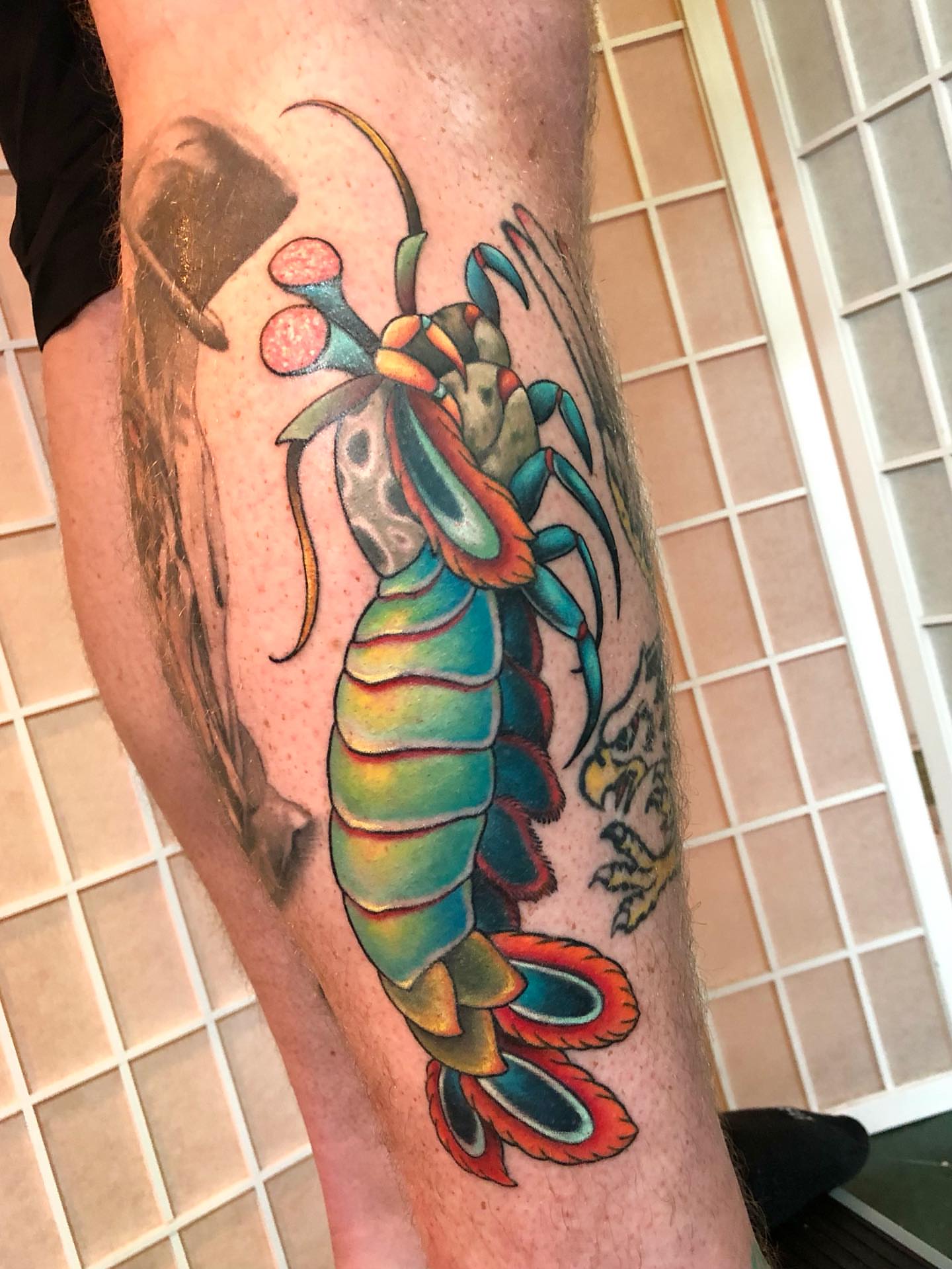 Lobster realism tattoo on the leg by Leah Leinani